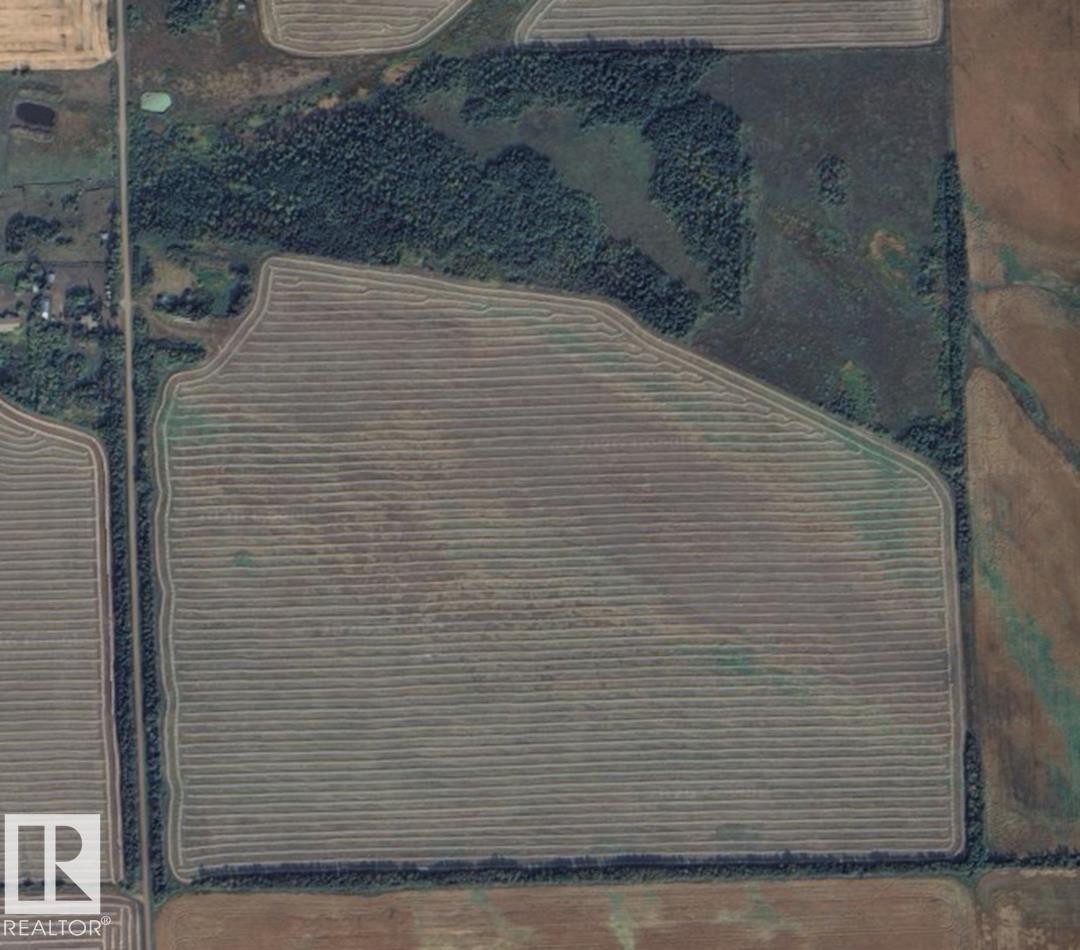 Expansive agricultural field with distinct crop rows - Rr171 Twp 562, Rural Lamont County, AB