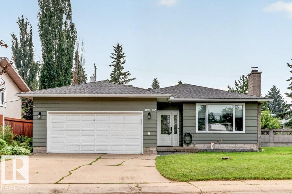 Single-story exterior with horizontal siding, attached two-car garage, and a prominent front door with decorative glass - 11131 35A Avenue Nw, Edmonton, AB - Outdoor