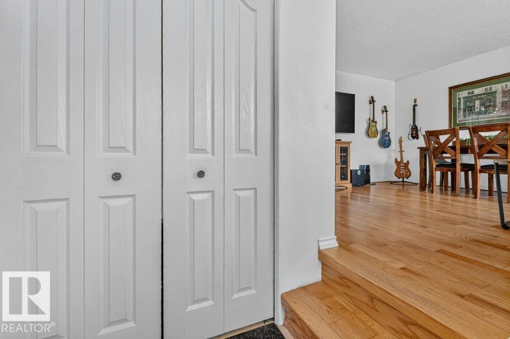 White bi-fold doors with panel detailing - 11131 35A Avenue Nw, Edmonton, AB - Indoor