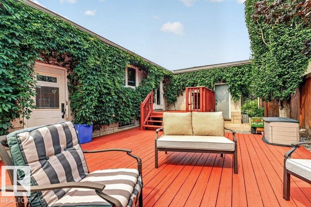 Expansive red-stained deck with direct building access - 11131 35A Avenue Nw, Edmonton, AB - Outdoor With Deck Patio Veranda With Exterior
