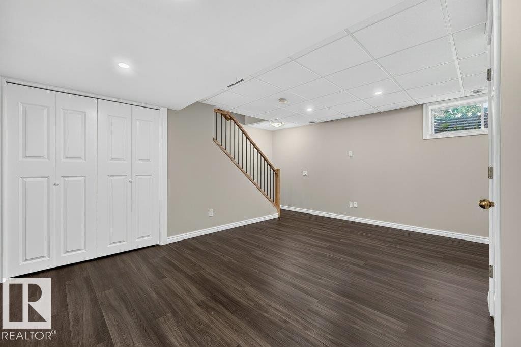 Wood-finish flooring, recessed lighting, and a neutral color palette - #26 2816 34 Av Nw, Edmonton, AB