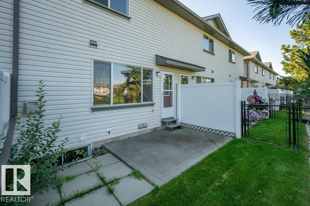 Rear patio with concrete slab - #26 2816 34 Av Nw, Edmonton, AB