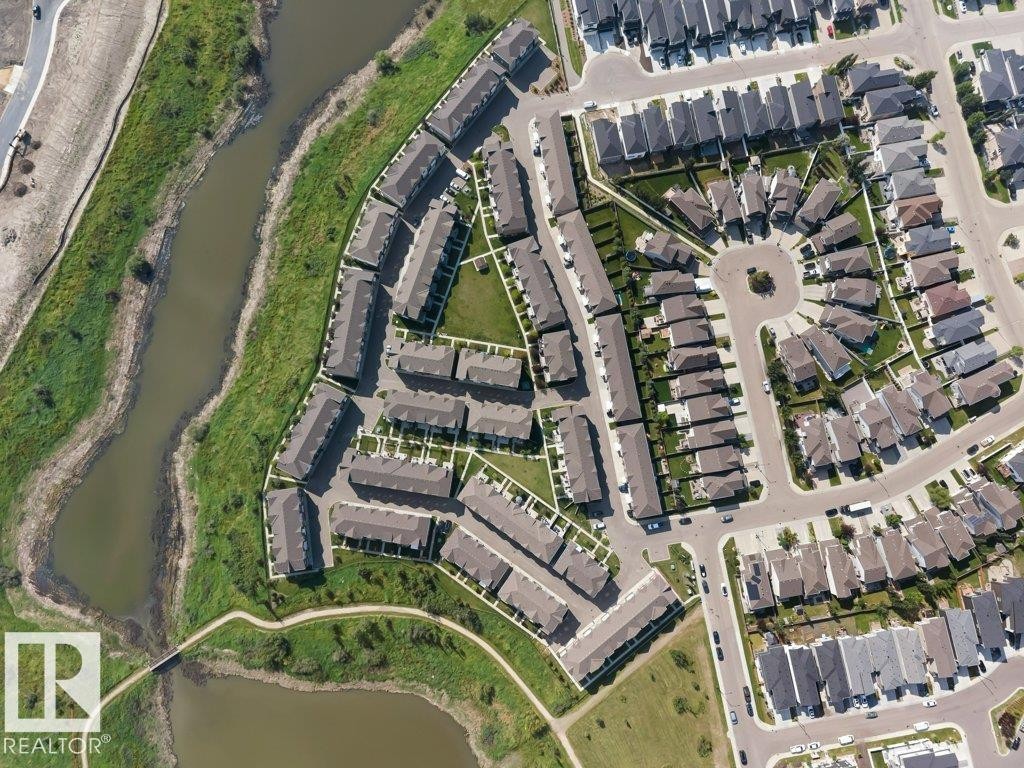 Aerial perspective showcasing a residential development with structured street layouts - #45 16903 68 St Nw, Edmonton, AB