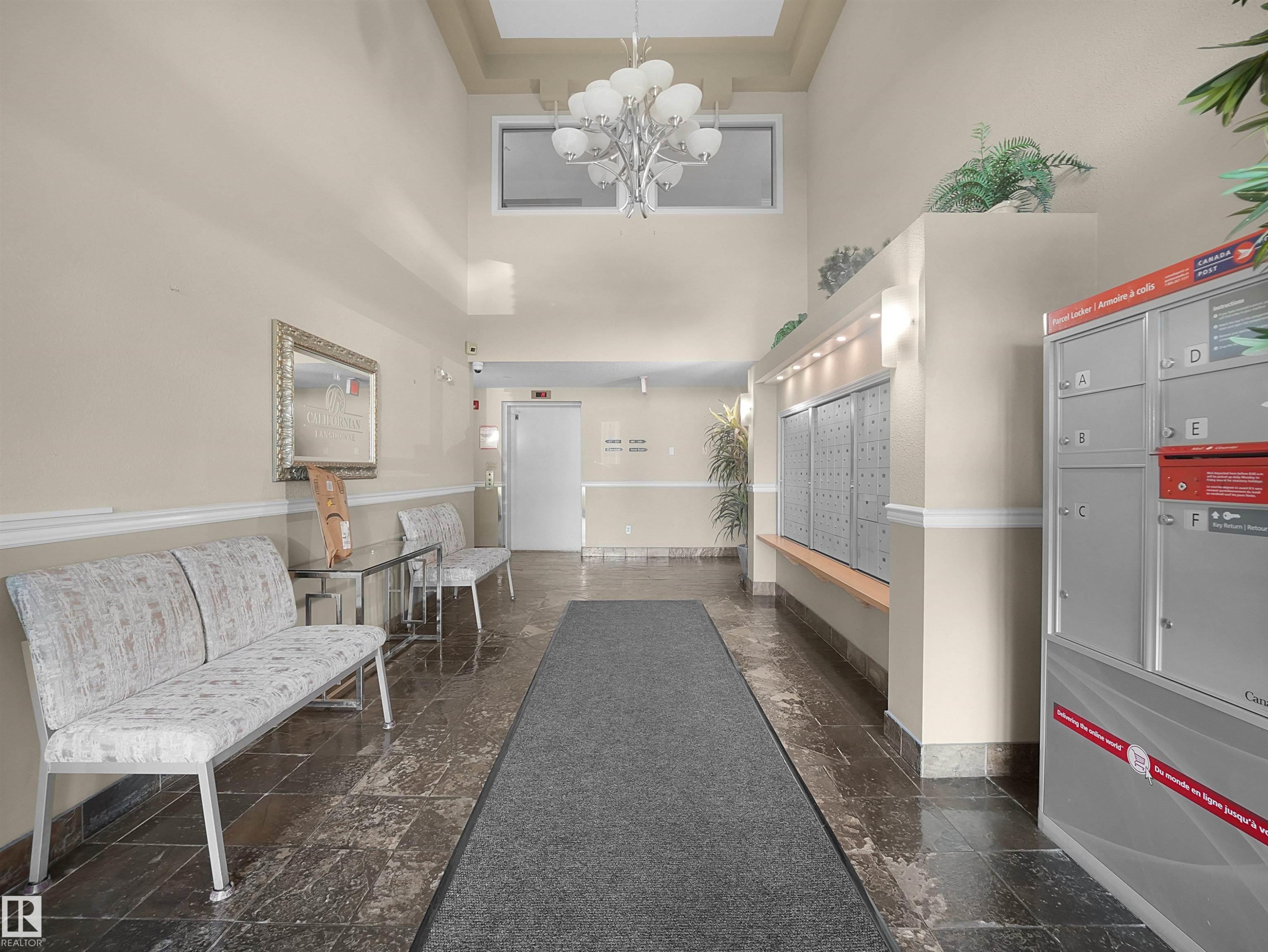 Foyer with tiled flooring, high ceilings, and recessed lighting - #206 12111 51 Av Nw, Edmonton, AB