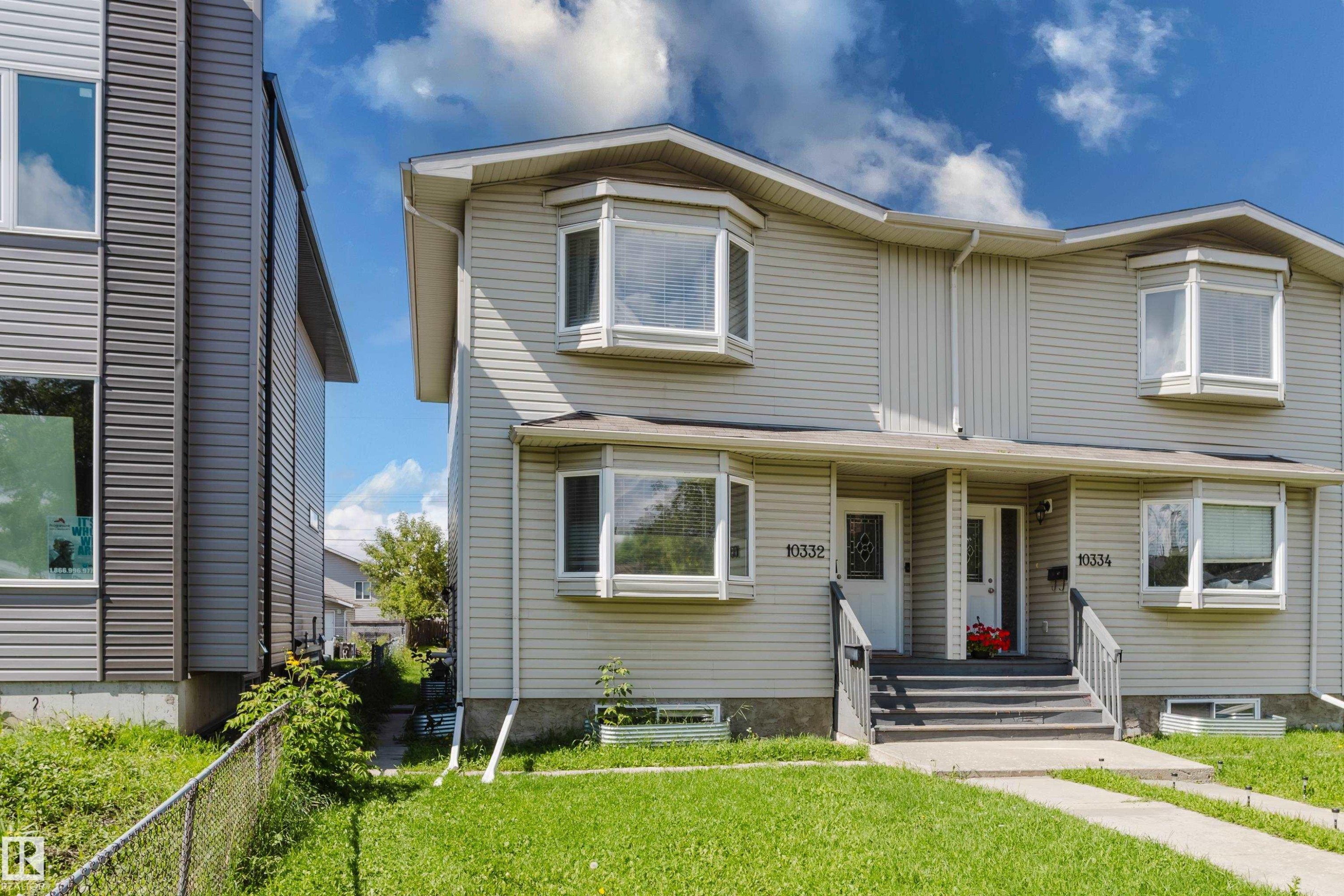 Two-story duplex with light-colored siding - 10332 161 Street Nw, Edmonton, AB