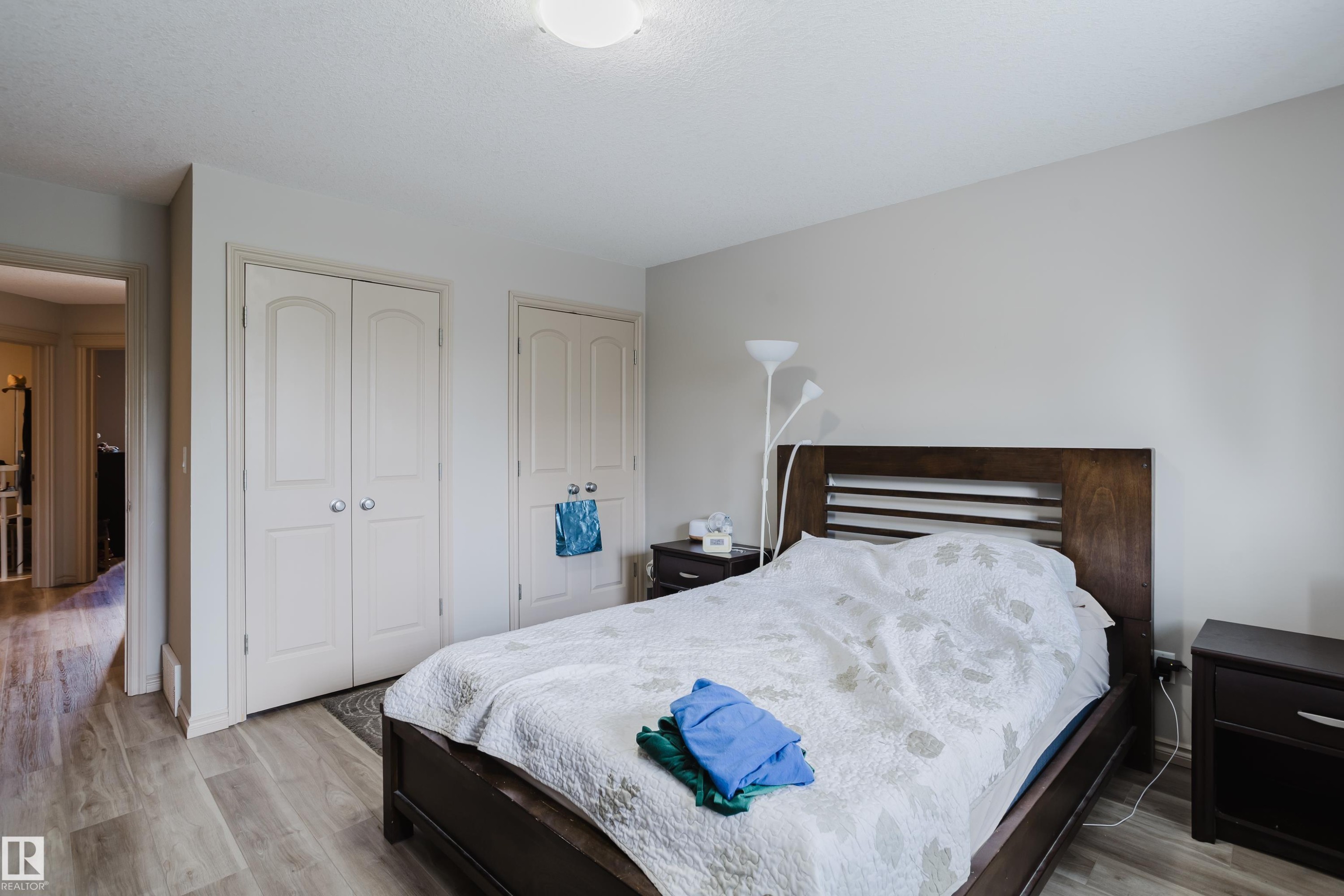 Light wood-finish flooring, recessed ceiling light, and neutral wall tones - 10334 161 Street Nw, Edmonton, AB