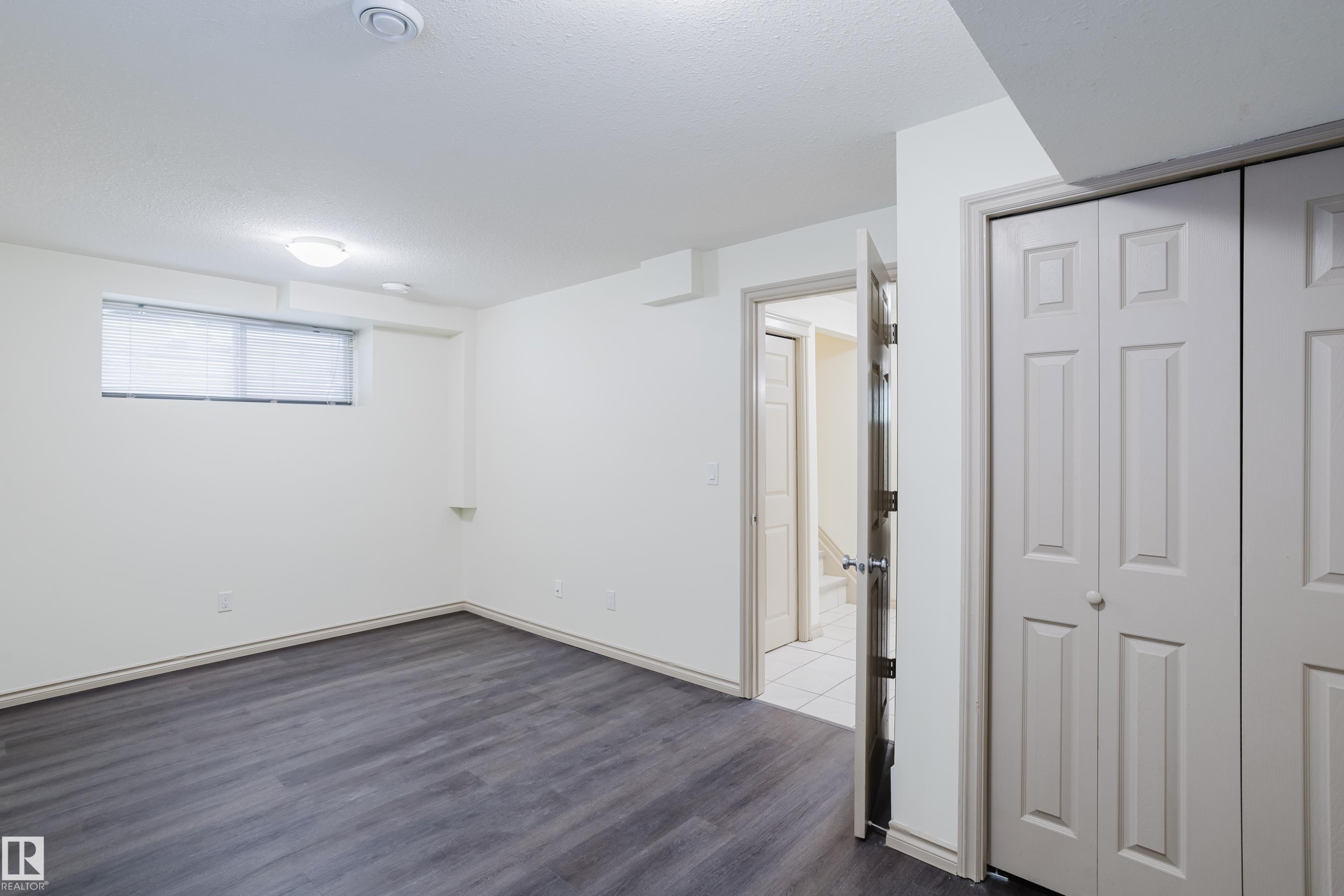 Wood-finish flooring, recessed lighting, and a flush-mount light fixture - 10334 161 Street Nw, Edmonton, AB