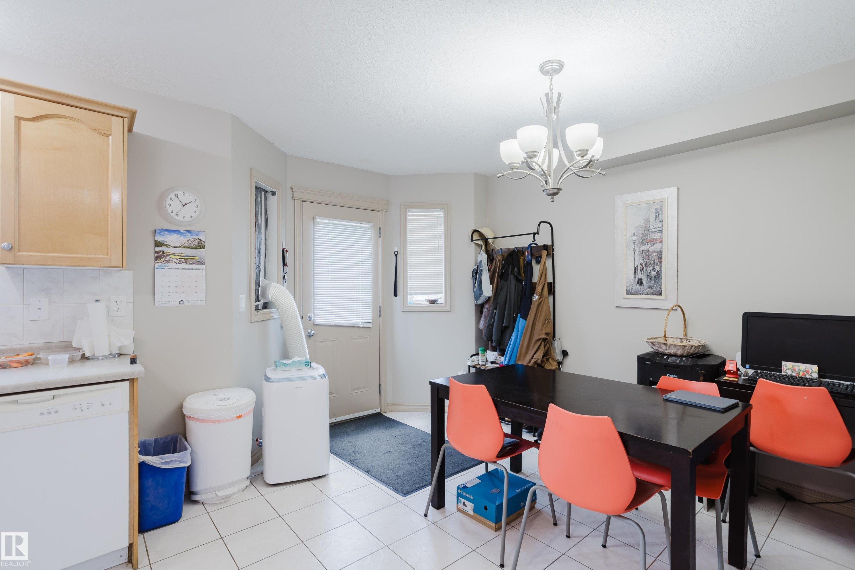 Kitchen with wood-finish cabinetry, white tile flooring, and a dishwasher - 10334 161 Street Nw, Edmonton, AB