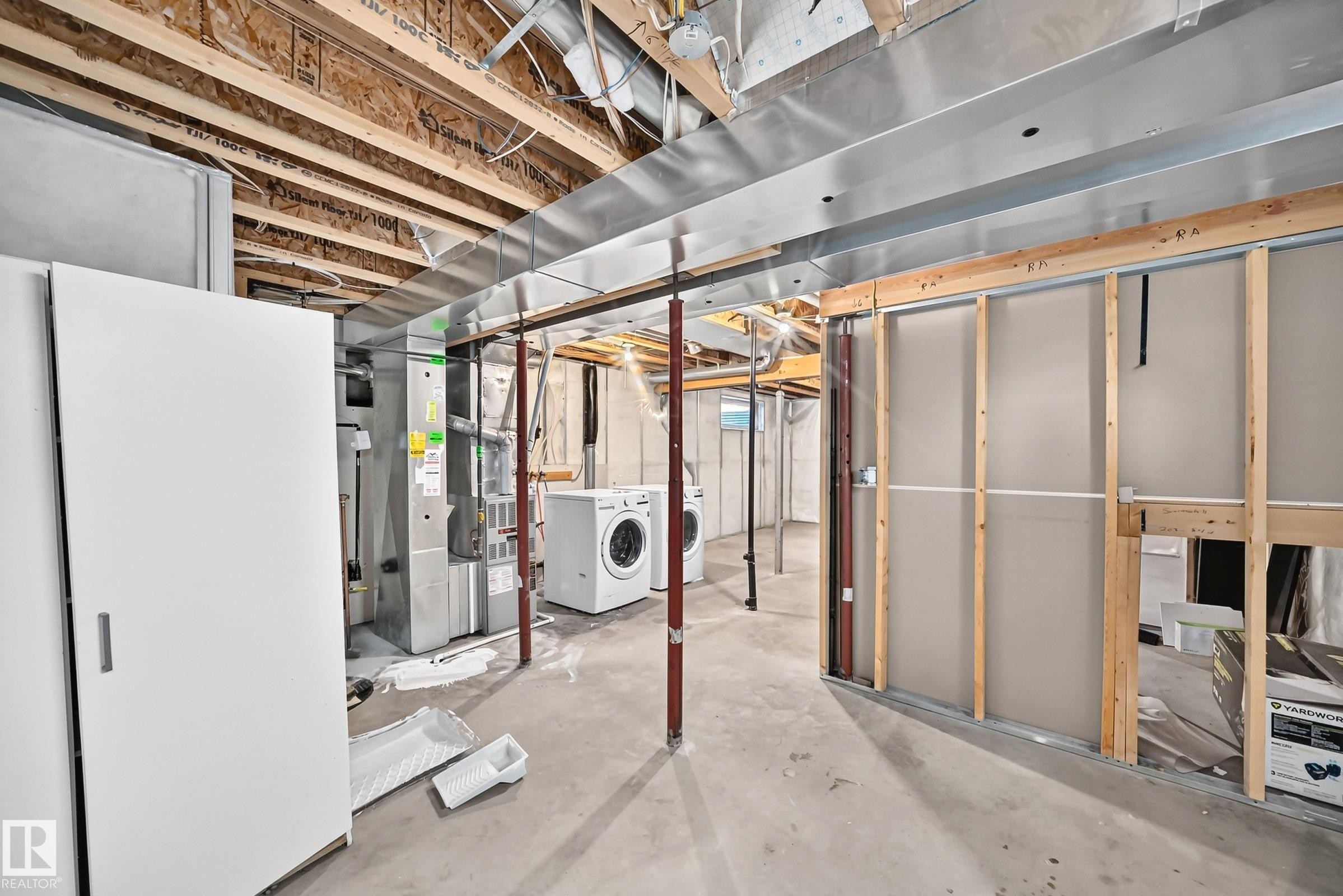 Unfinished basement space featuring exposed wood joists, ductwork, and framing for future customization - 203 84 Street Sw, Edmonton, AB - Indoor Photo Showing Basement