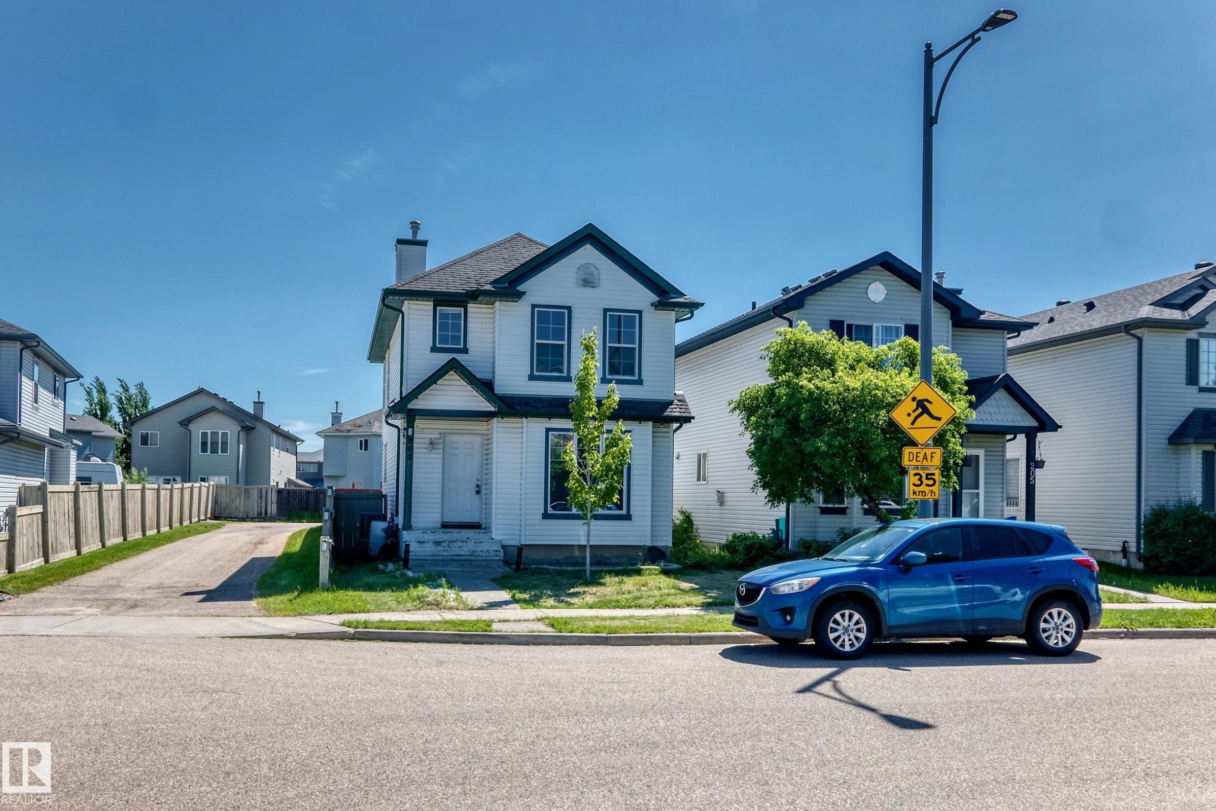Two-story home with white siding and dark trim detailing - 203 84 Street Sw, Edmonton, AB - Outdoor With Facade
