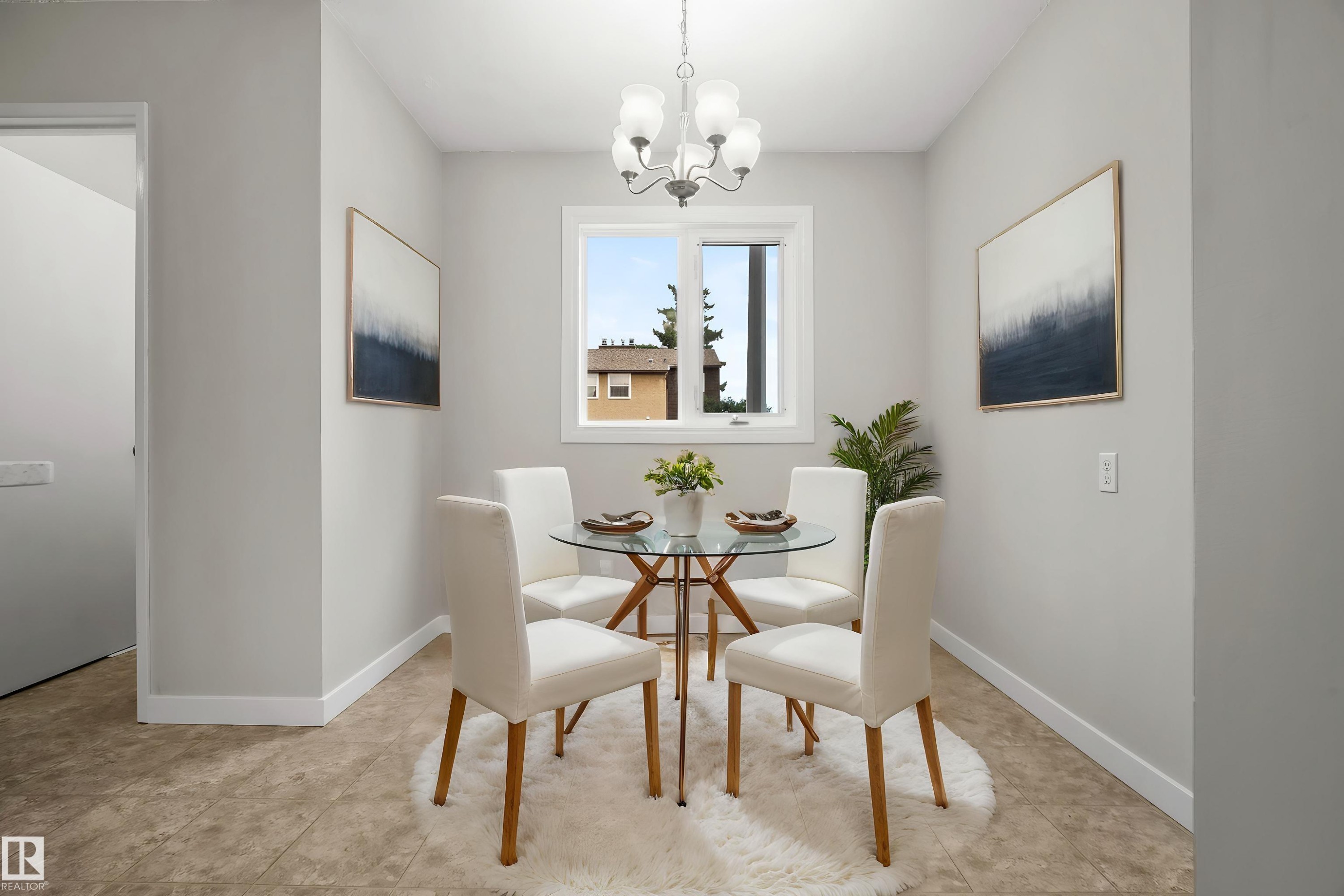 Recessed window with natural light, neutral wall colors, overhead chandelier, and patterned flooring - 3173 139 Avenue Nw, Edmonton, AB