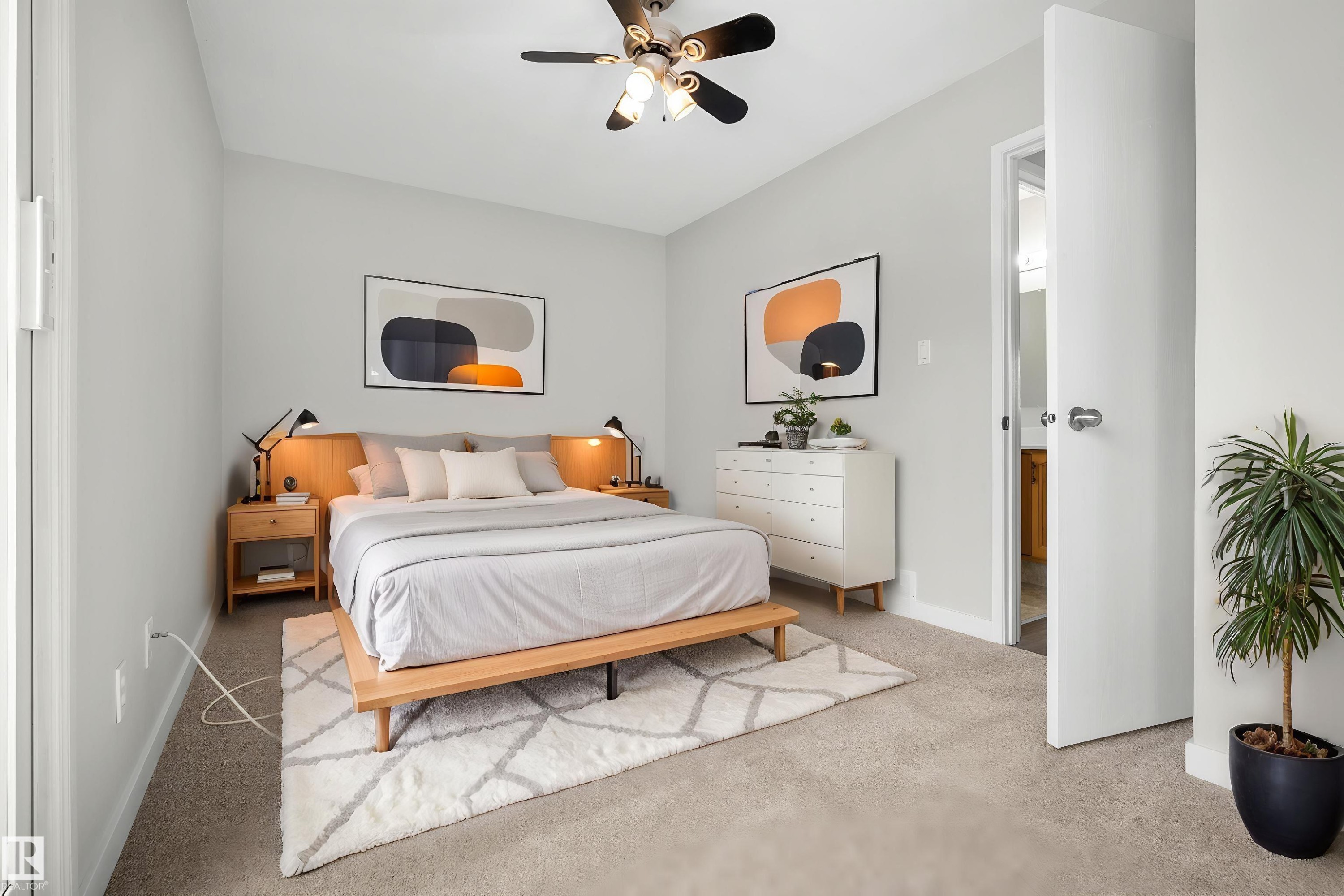 Light gray wall color, wall-to-wall carpeting, and a ceiling fan with integrated lighting - 3173 139 Avenue Nw, Edmonton, AB