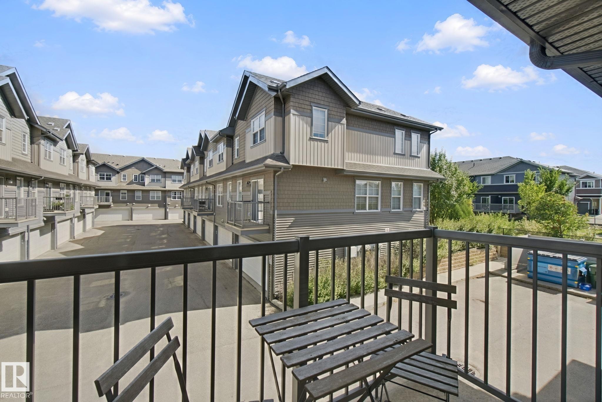 Balcony with black metal railing - #58 4029 Orchards Dr Sw, Edmonton, AB