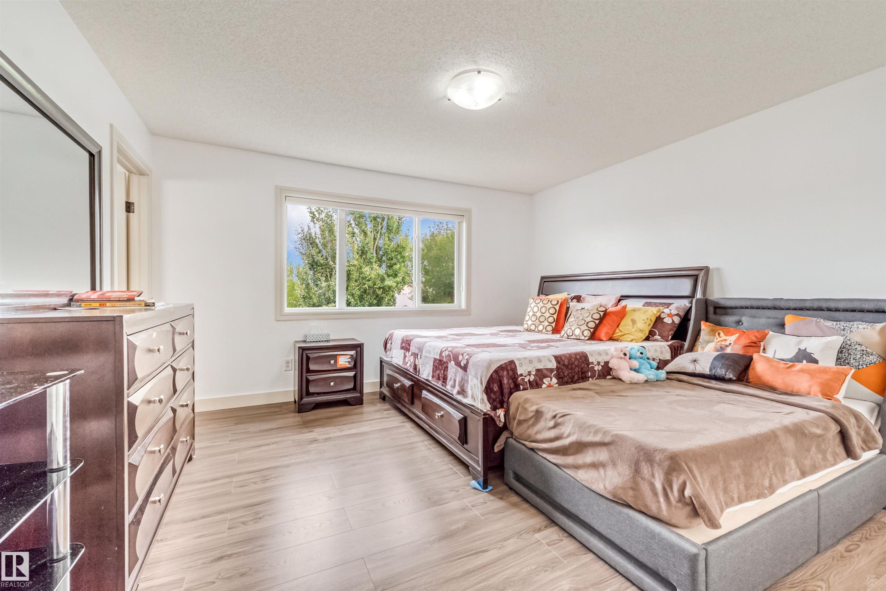 White walls with wood-finish flooring - 20324 48 Avenue Nw, Edmonton, AB