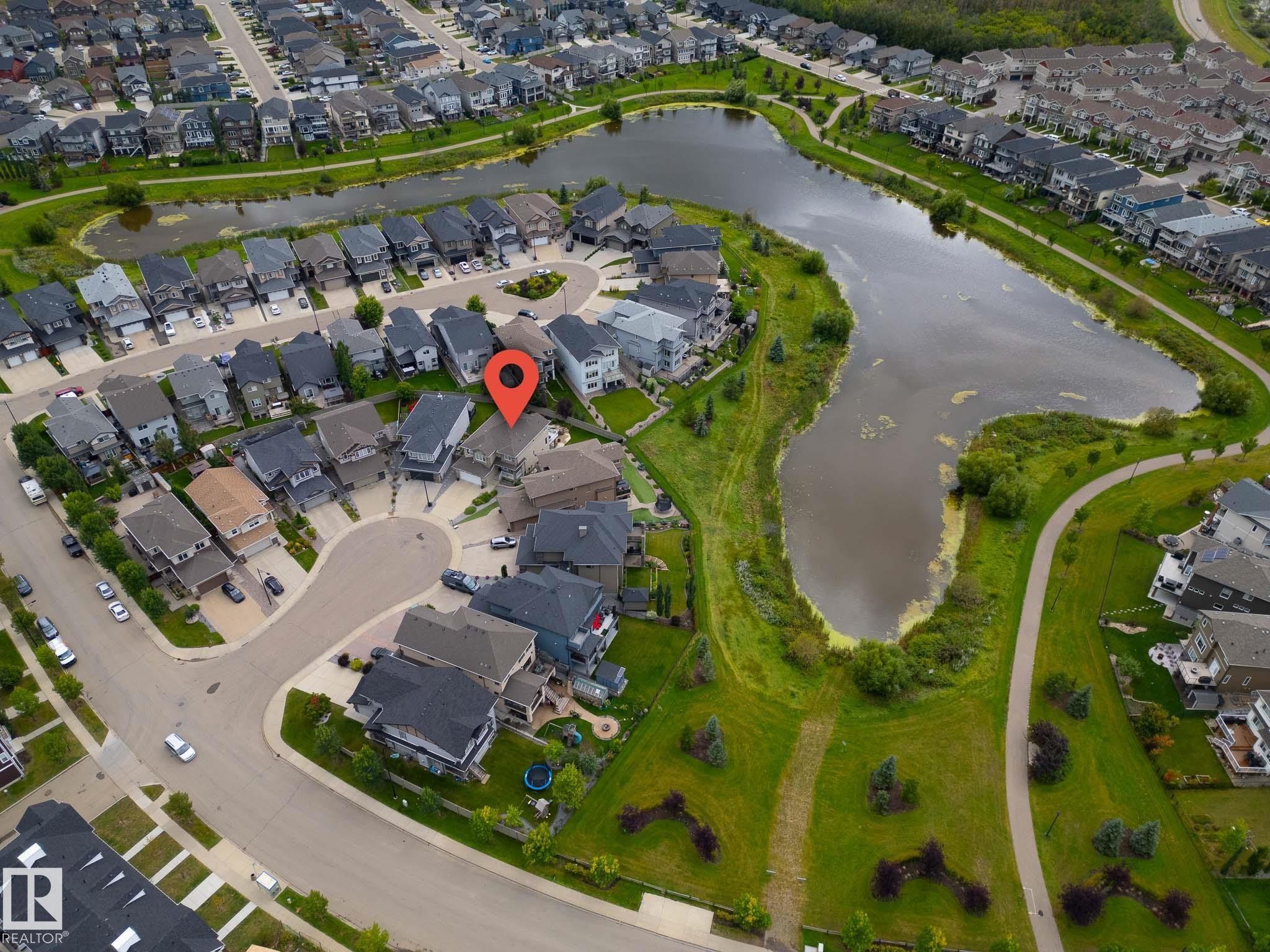 Residential property situated on a cul-de-sac, offering proximity to a large pond and paved walking paths - 914 Crystallina Nera Way Nw, Edmonton, AB