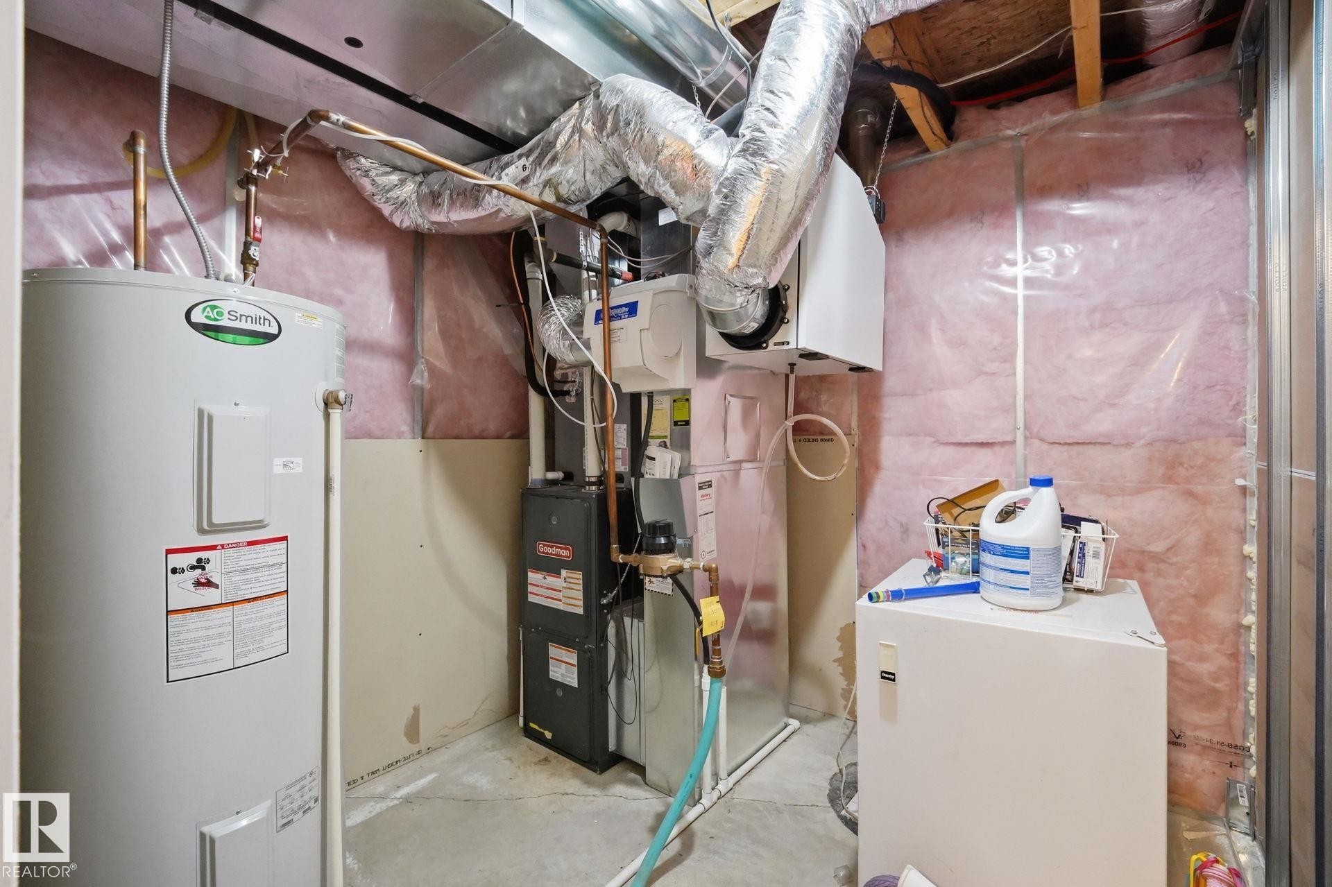 Water heater, furnace, and exposed ductwork - 17621 10 Avenue Sw, Edmonton, AB - Indoor Photo Showing Basement
