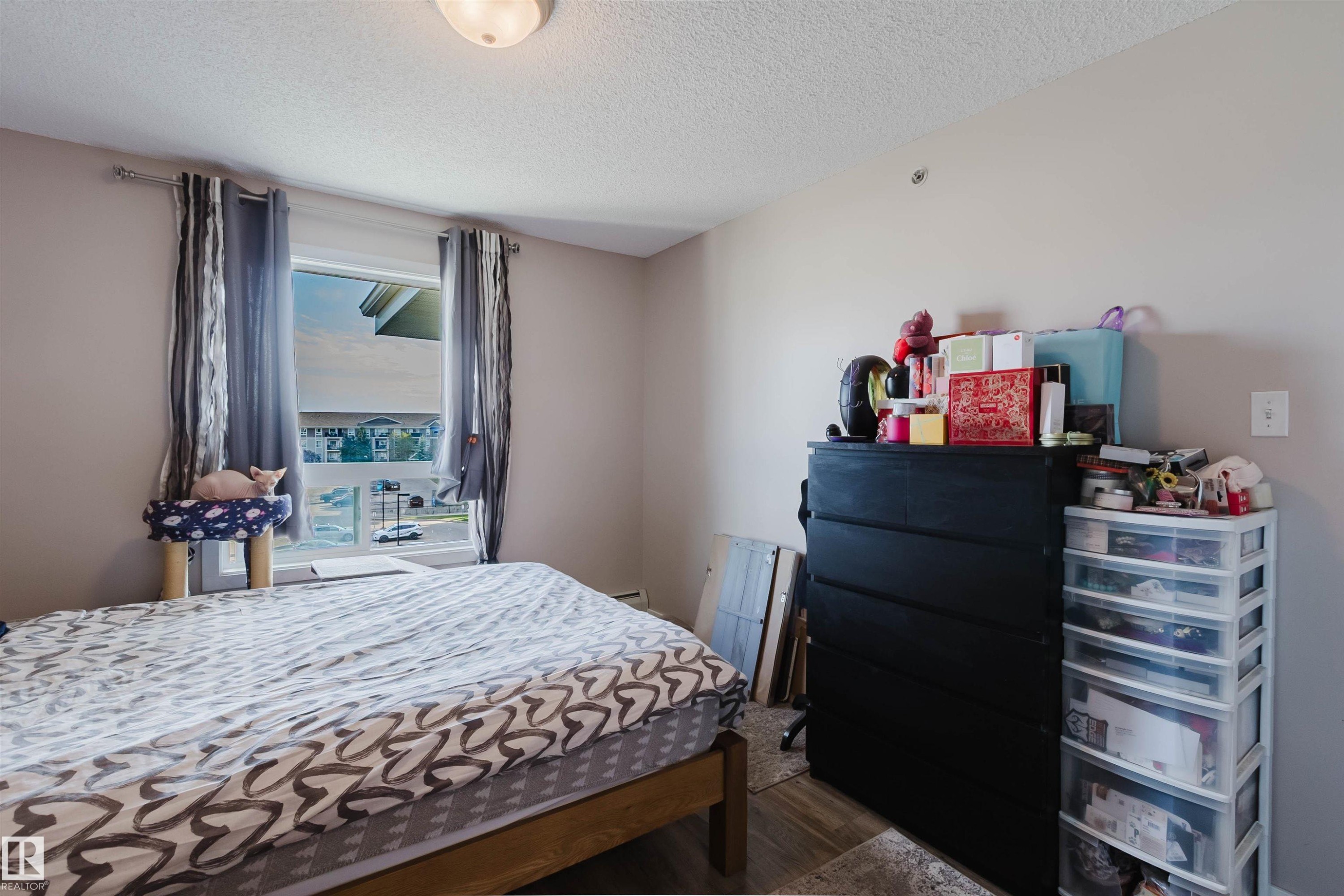 Wood-finish flooring with a neutral wall color and window - #7428 7327 South Terwillegar Dr Nw, Edmonton, AB
