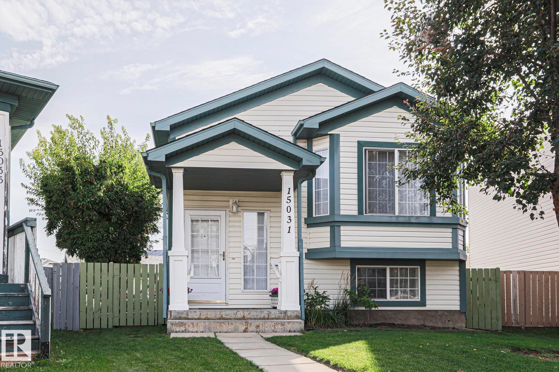 Two-story residence featuring light-colored siding and dark trim - 15031 135 Street Nw, Edmonton, AB