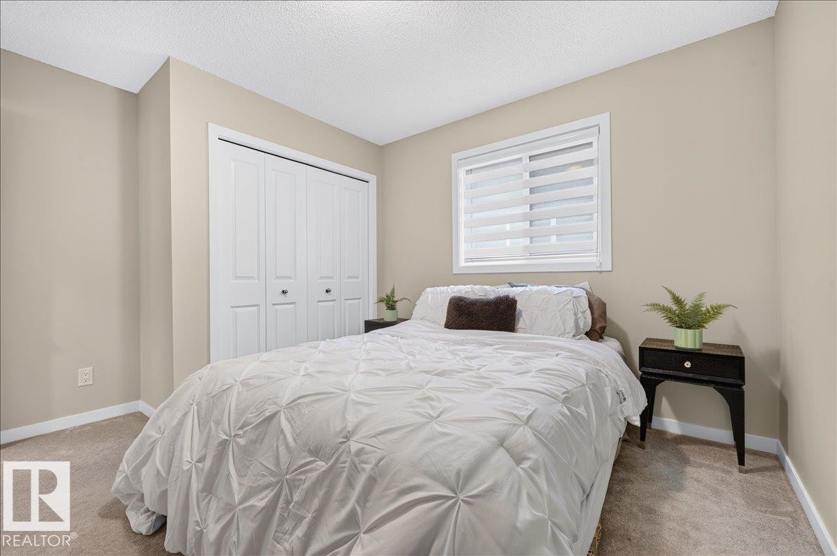 Room with light tan walls and beige carpet flooring - 2709 Collins Crescent Sw, Edmonton, AB - Indoor Photo Showing Bedroom