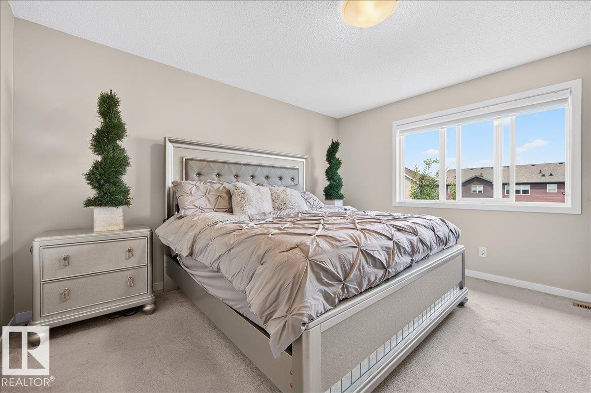 Spacious room featuring neutral-toned walls and carpeted flooring - 2709 Collins Crescent Sw, Edmonton, AB - Indoor Photo Showing Bedroom