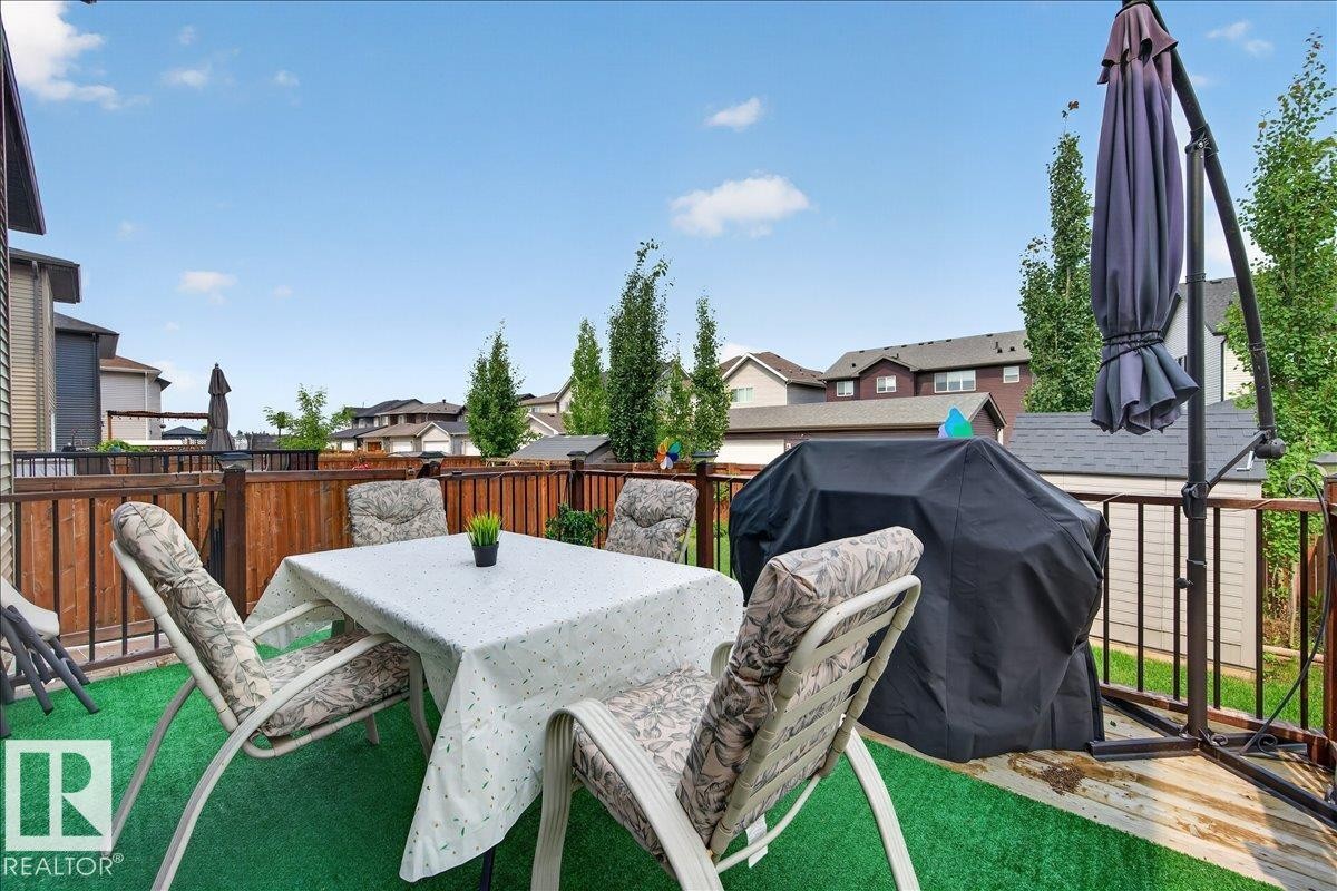 Elevated wooden deck with a privacy fence - 2709 Collins Crescent Sw, Edmonton, AB - Outdoor With Deck Patio Veranda