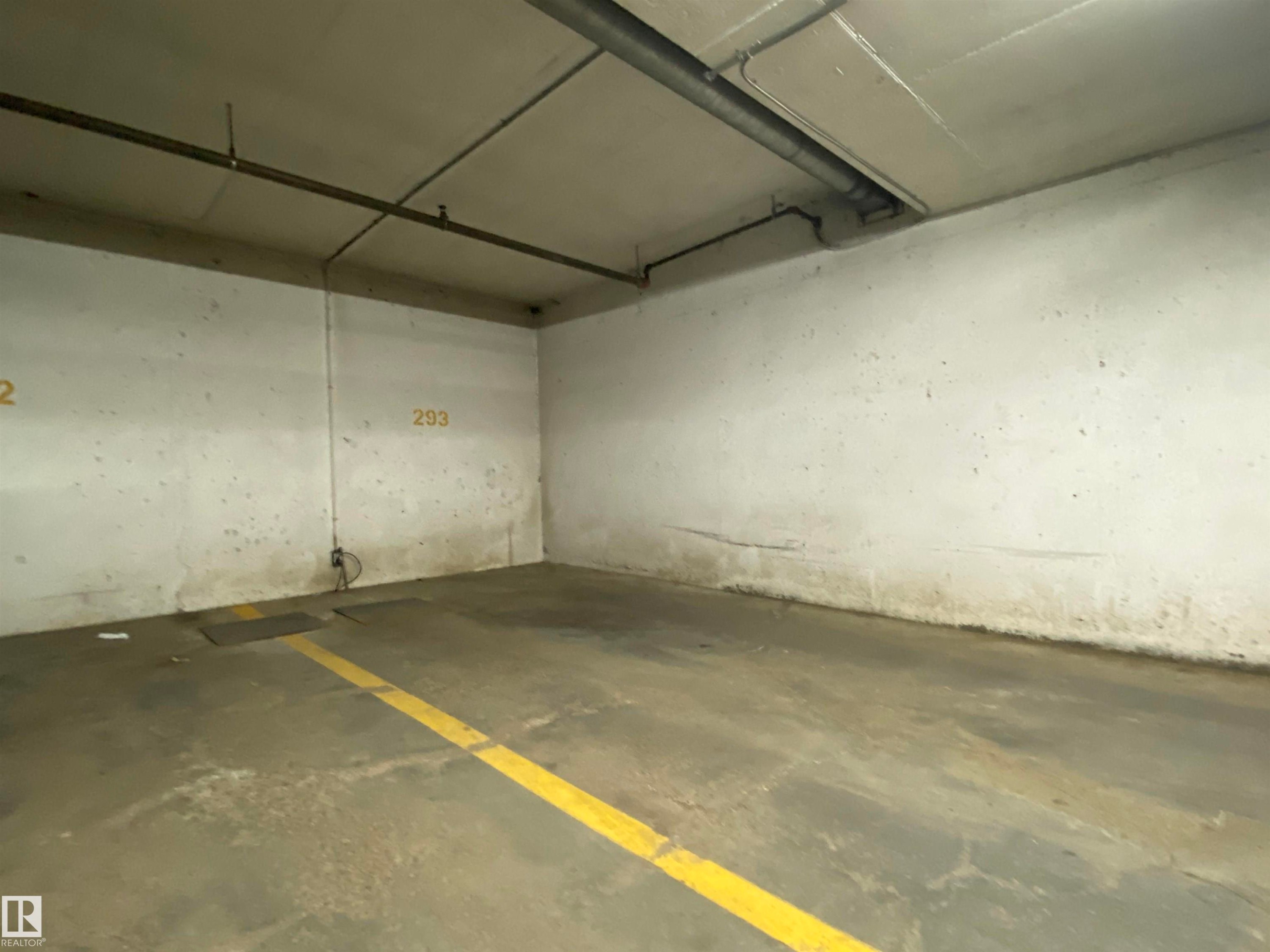 Designated parking stall - #105 155 Edwards Dr Sw, Edmonton, AB - Indoor Photo Showing Garage
