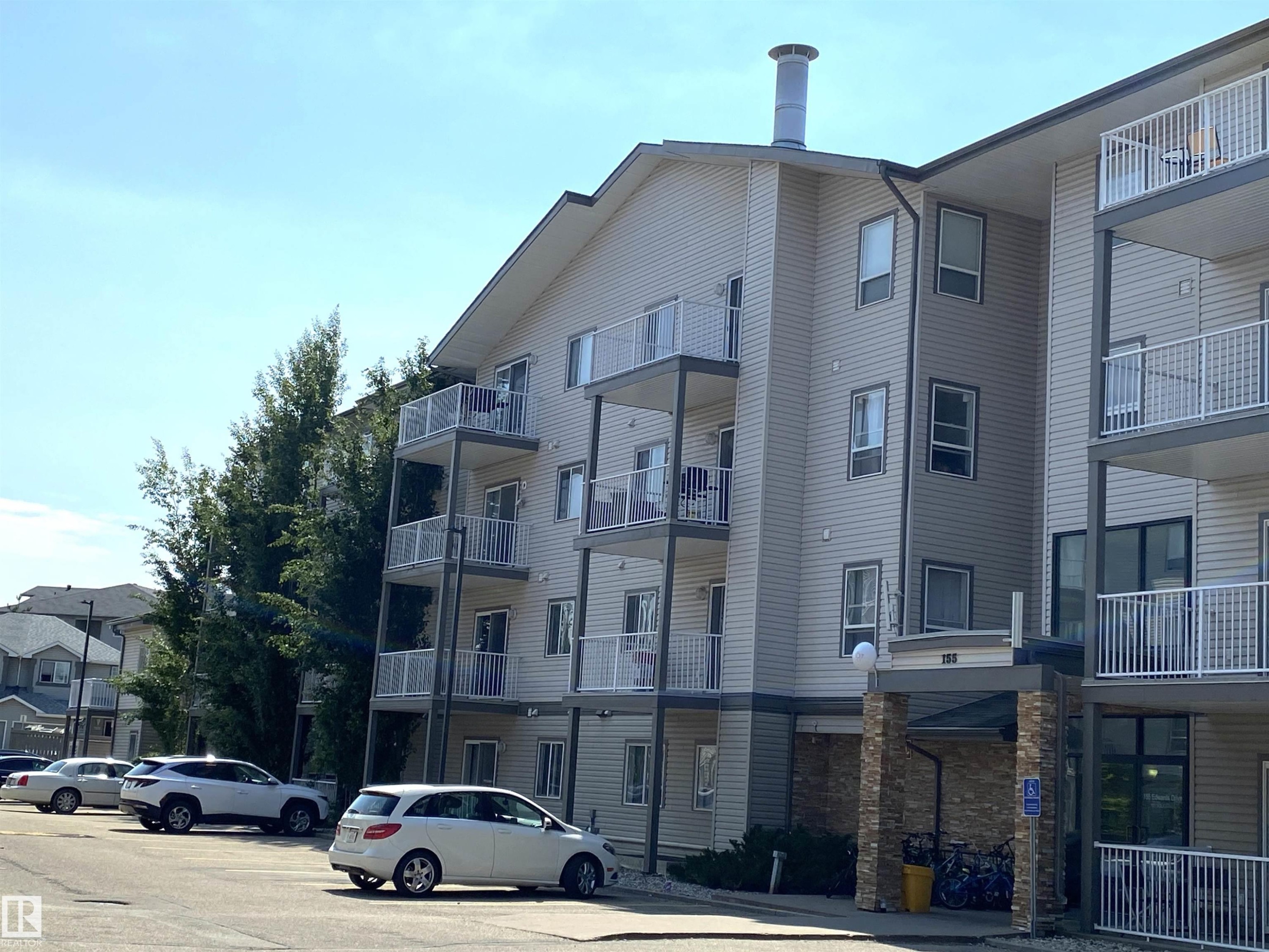 #105 155 Edwards Dr Sw, Edmonton, AB - Outdoor With Balcony With Facade