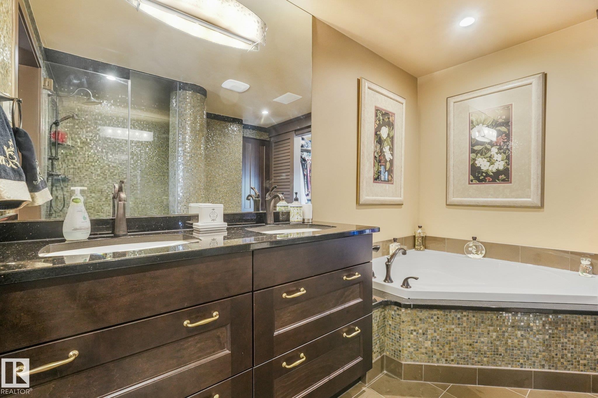 Dual vanity with dark wood-finish cabinetry and gold-tone hardware - 12827 150 Avenue Nw, Edmonton, AB