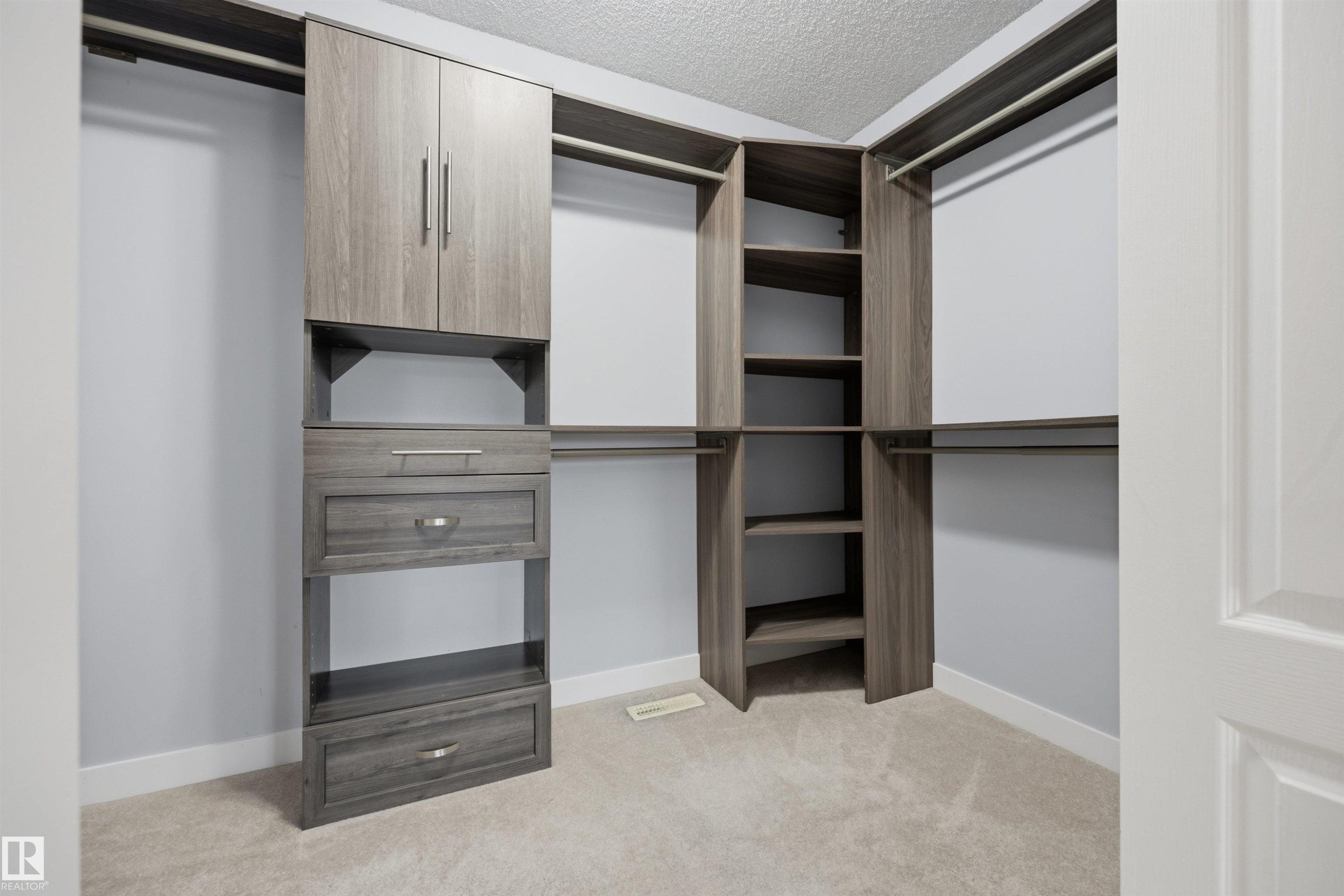 Very large walk-in closet connected to the primary bedroom - 6910 158A Avenue Nw, Edmonton, AB
