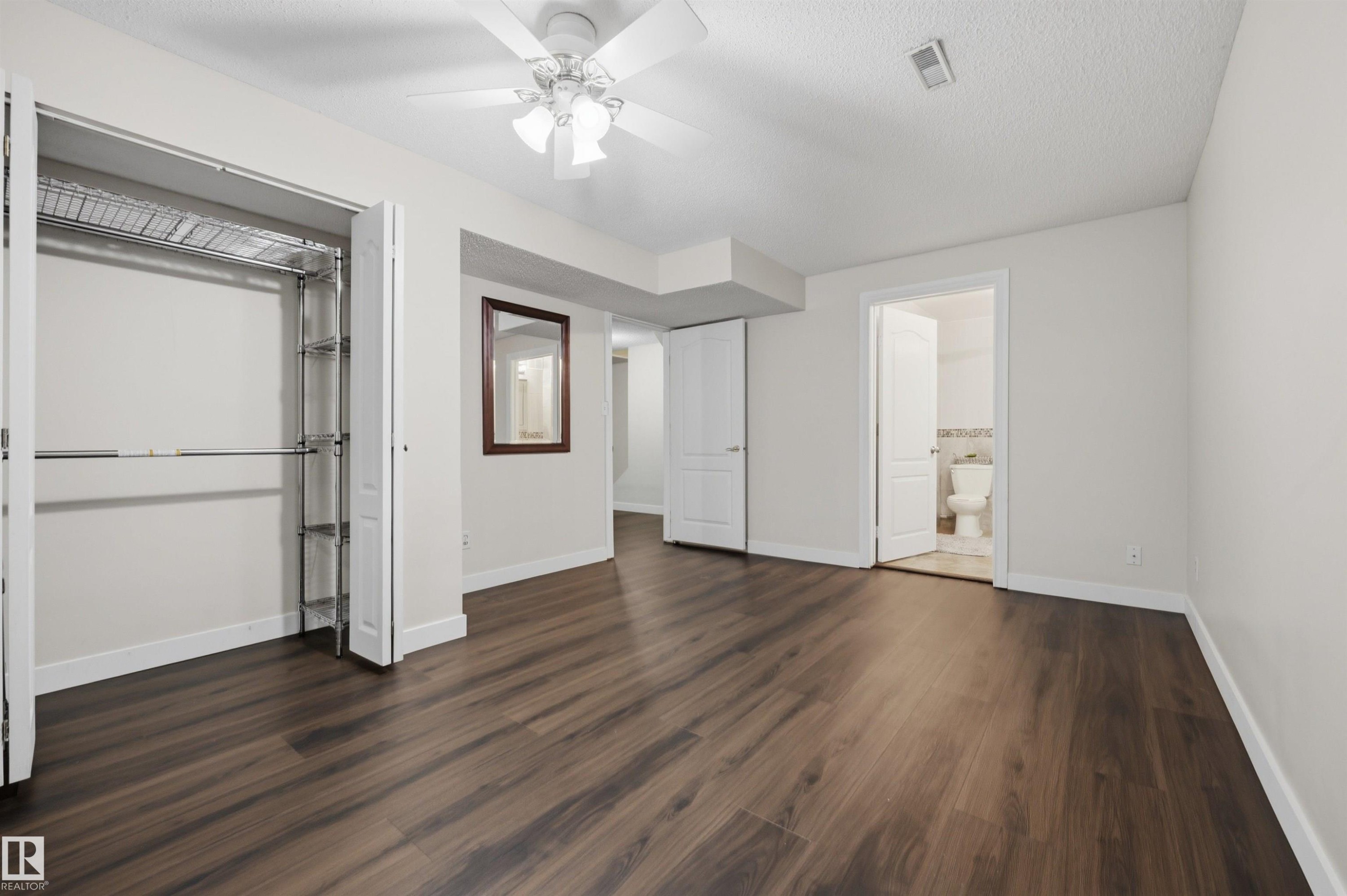 Large fully finished basement den with closet and ensuite bathroom - 6910 158A Avenue Nw, Edmonton, AB