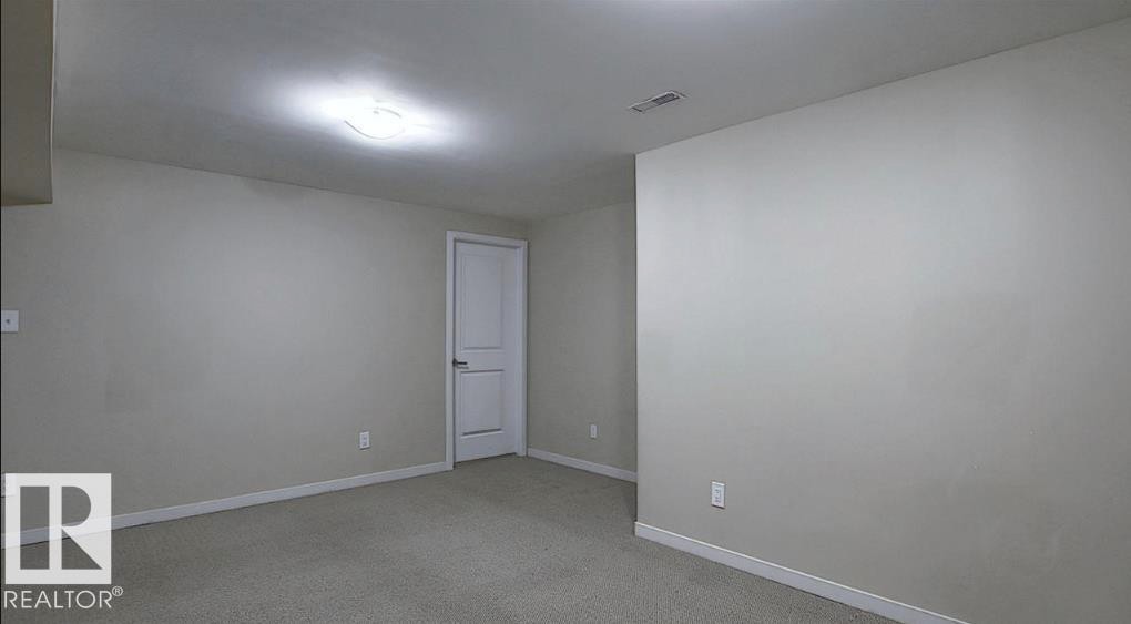 Neutral-toned walls with carpeted flooring - 12002 48 Street Nw, Edmonton, AB