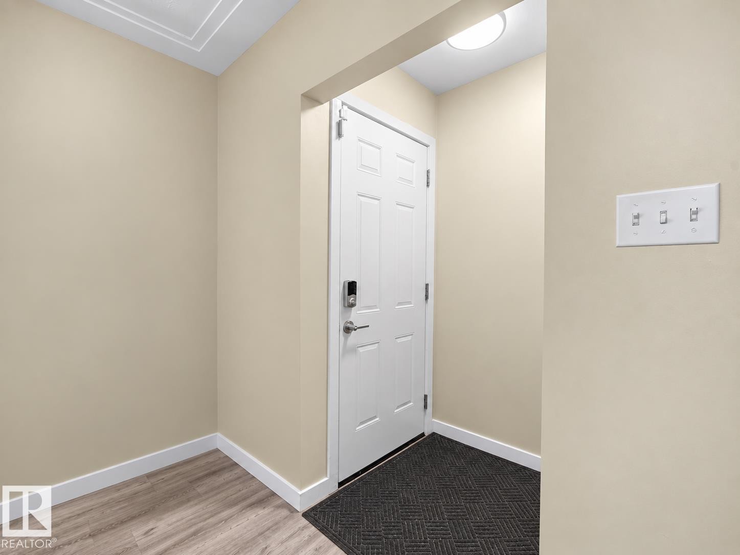 White paneled door with smart lock entry - 12002 48 Street Nw, Edmonton, AB
