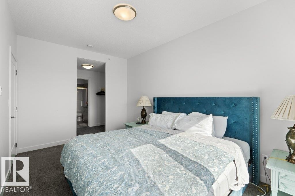 Carpeted sleeping area with white walls and ceiling - 1316 Windermere Way Sw, Edmonton, AB