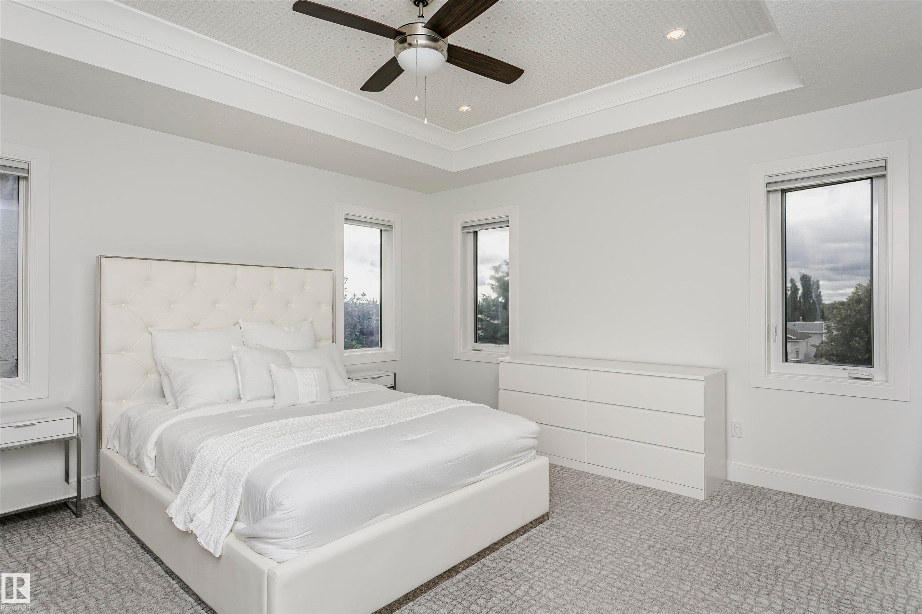 Tray ceiling with recessed lighting and a ceiling fan - 9107 181 Avenue Nw, Edmonton, AB