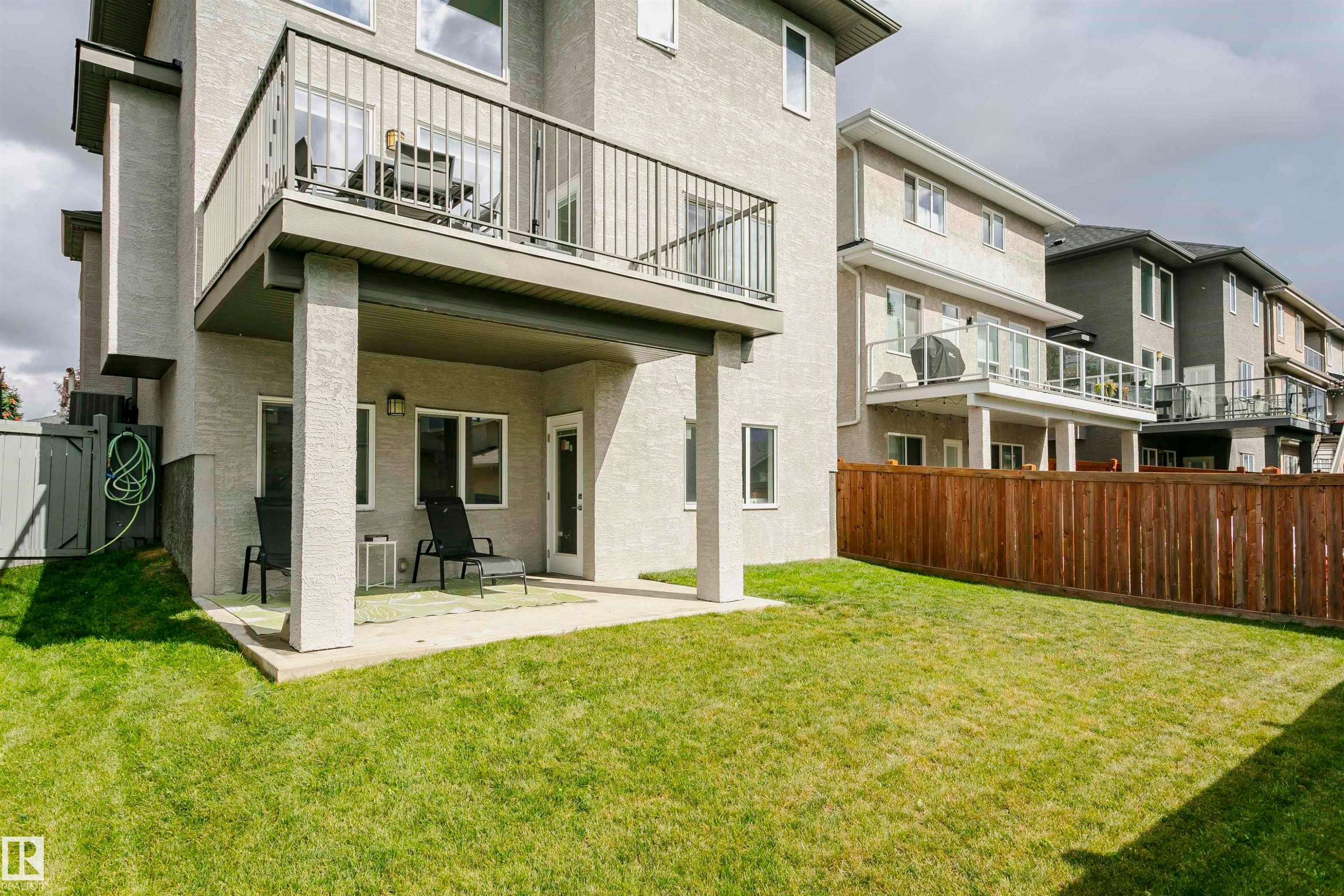 Private fenced backyard with a concrete patio - 9107 181 Avenue Nw, Edmonton, AB