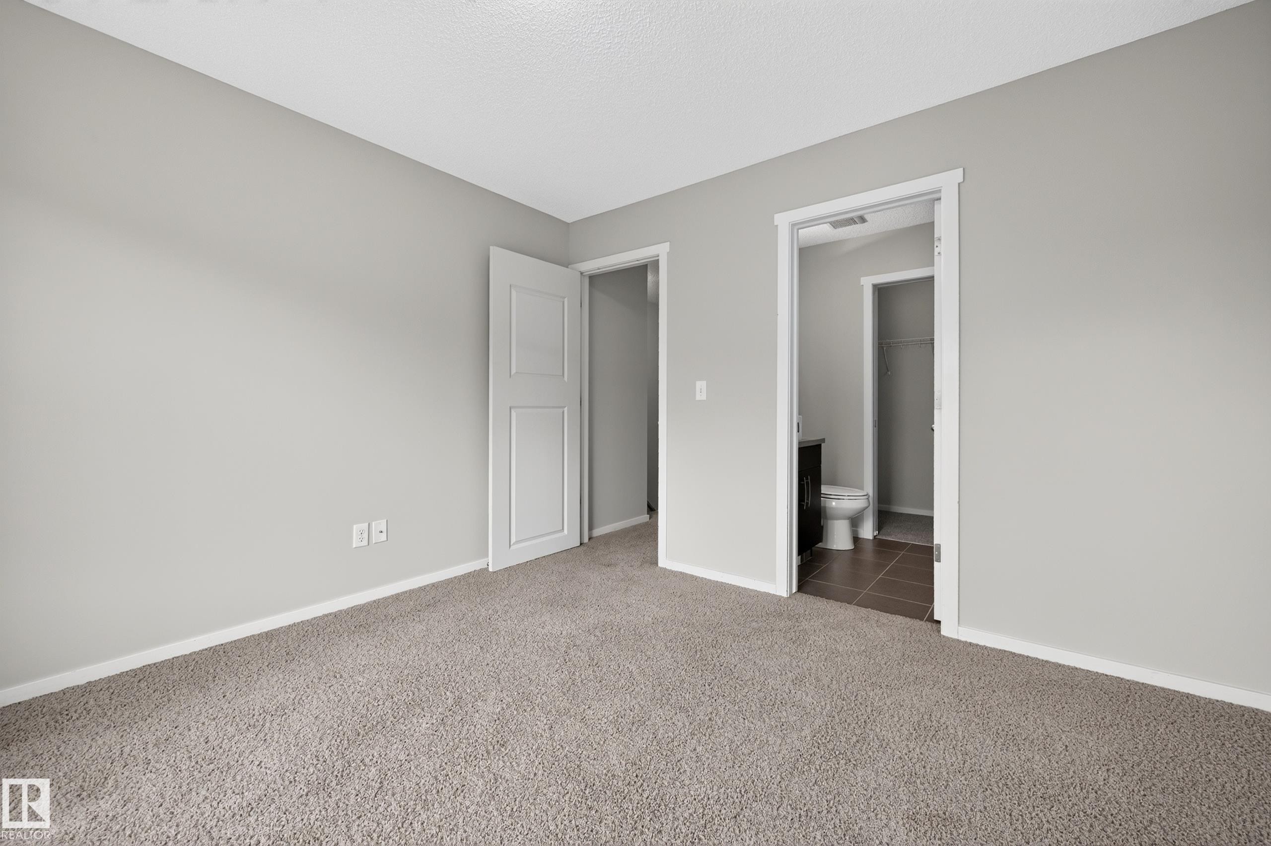 Carpeted flooring with light gray walls and white trim - #72 603 Watt Bv Sw Sw, Edmonton, AB
