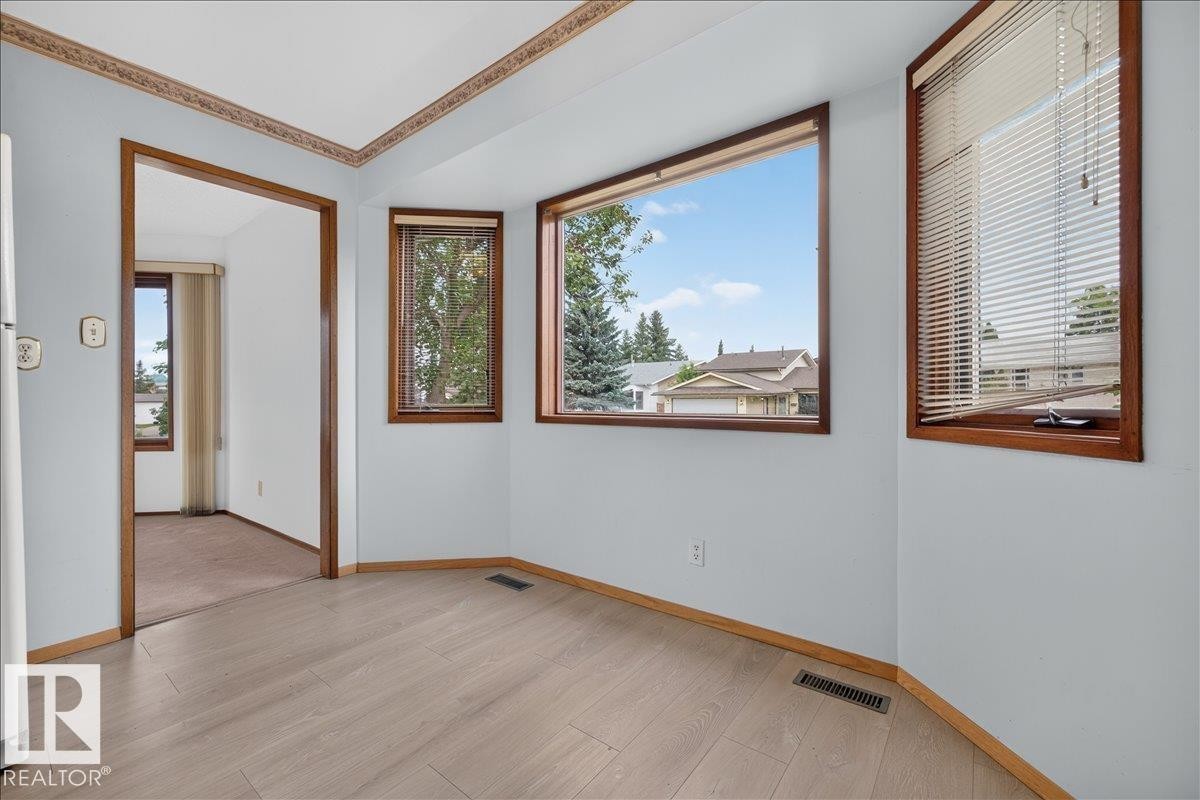 Wood-finish flooring with a light tone - 2907 49 Street Nw, Edmonton, AB