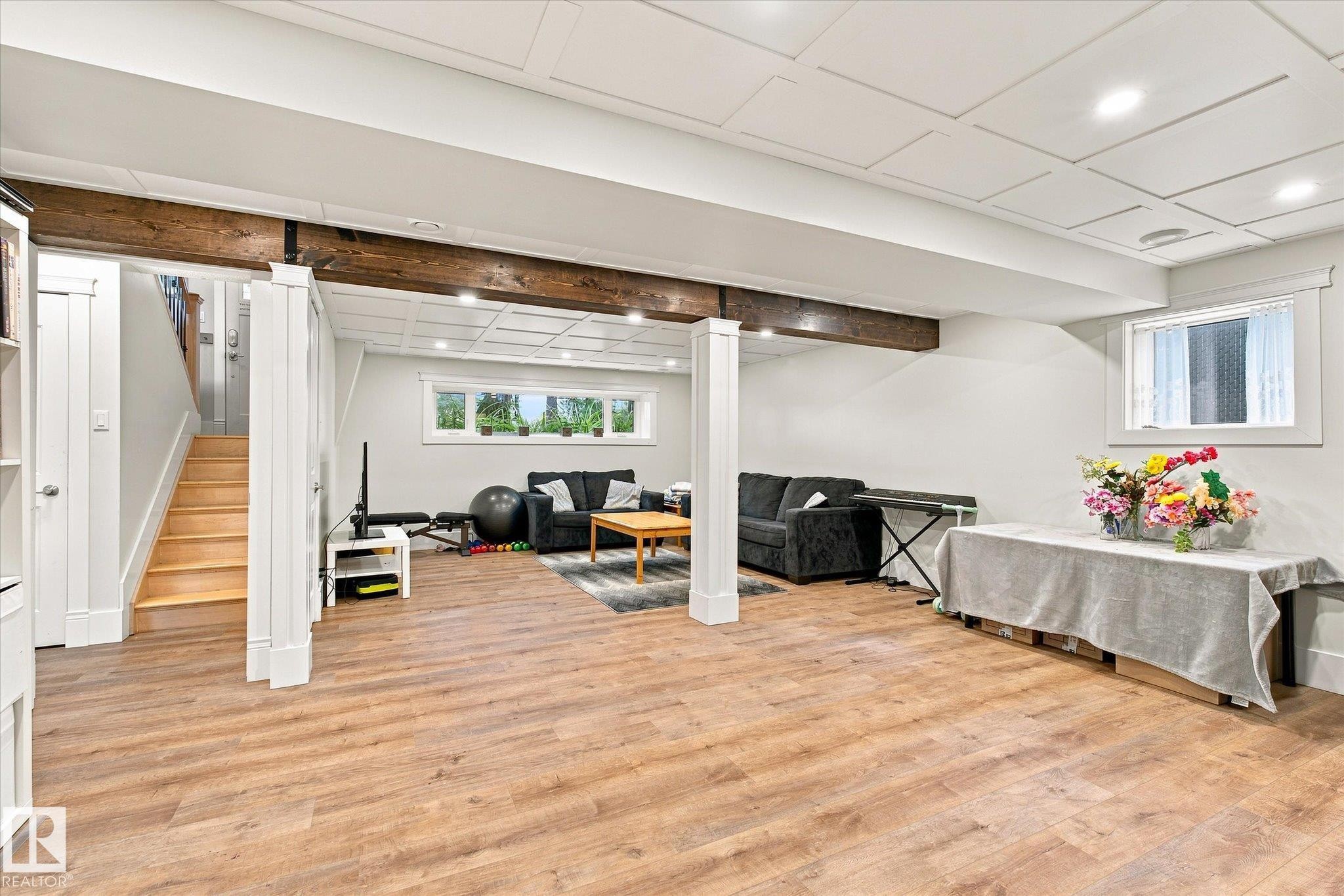 Recessed lighting, wood-finish flooring, exposed wood beams, coffered ceiling, and white trim windows - 3 Akins Drive, St. Albert, AB