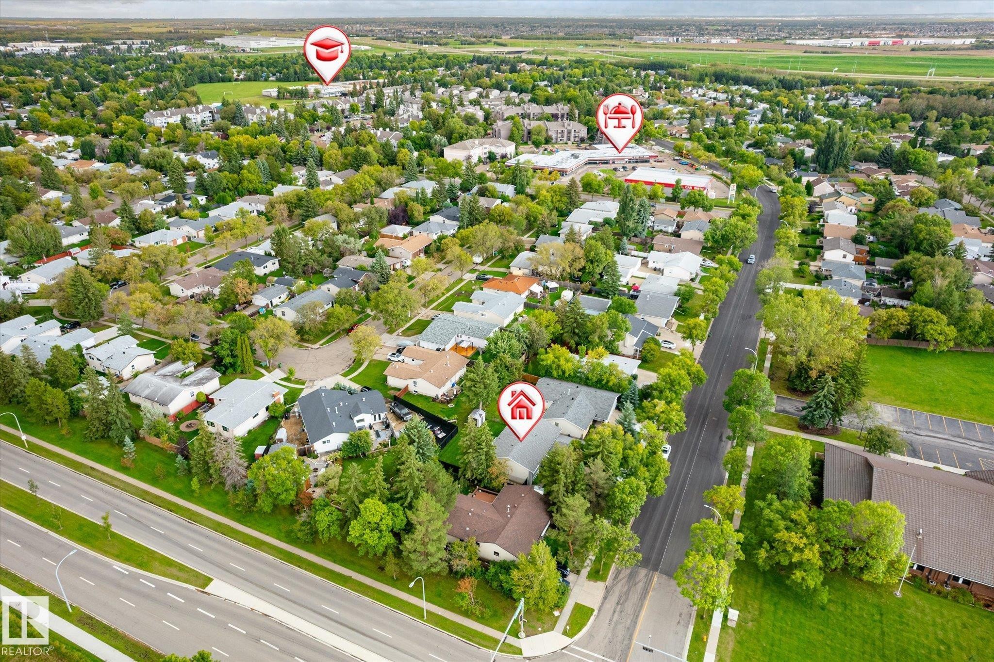 Aerial perspective showcasing residential properties with established trees and surrounding green spaces - 3 Akins Drive, St. Albert, AB