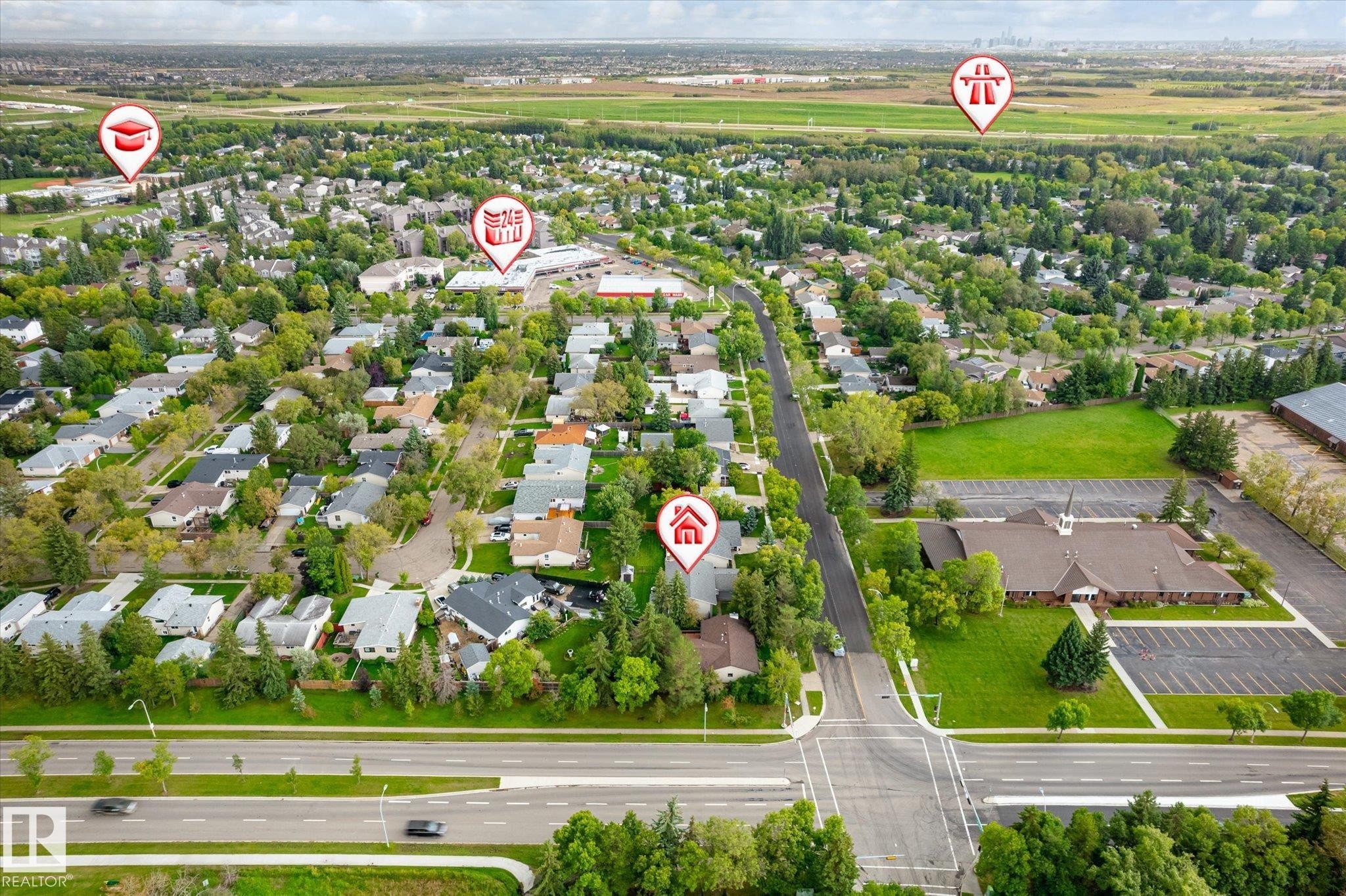 Aerial view of a residential neighborhood with established homes, tree-lined streets, and paved roadways - 3 Akins Drive, St. Albert, AB