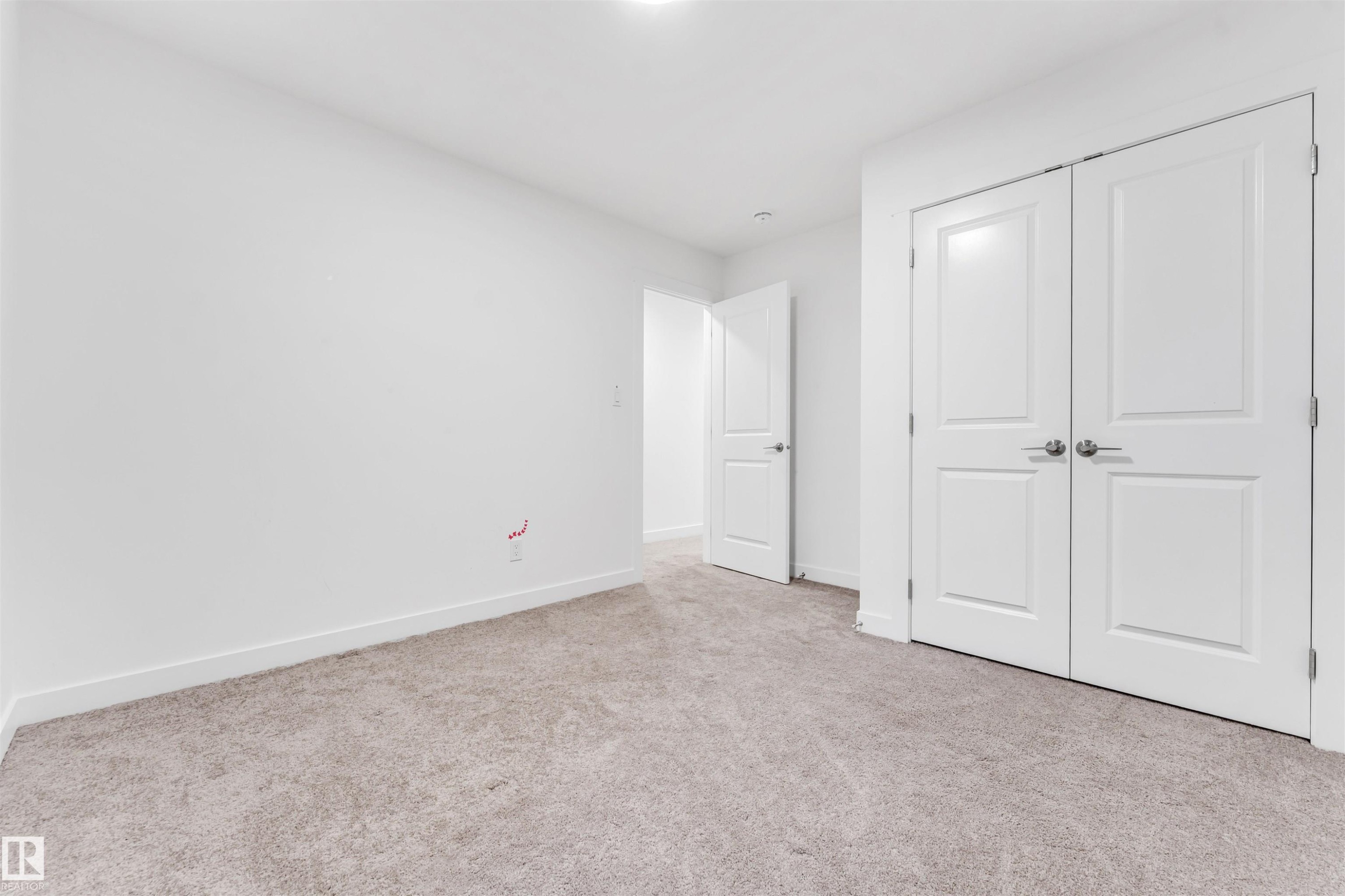 Neutral-toned carpeting, white walls, and bright overhead lighting - #45 2710 66 St Sw, Edmonton, AB