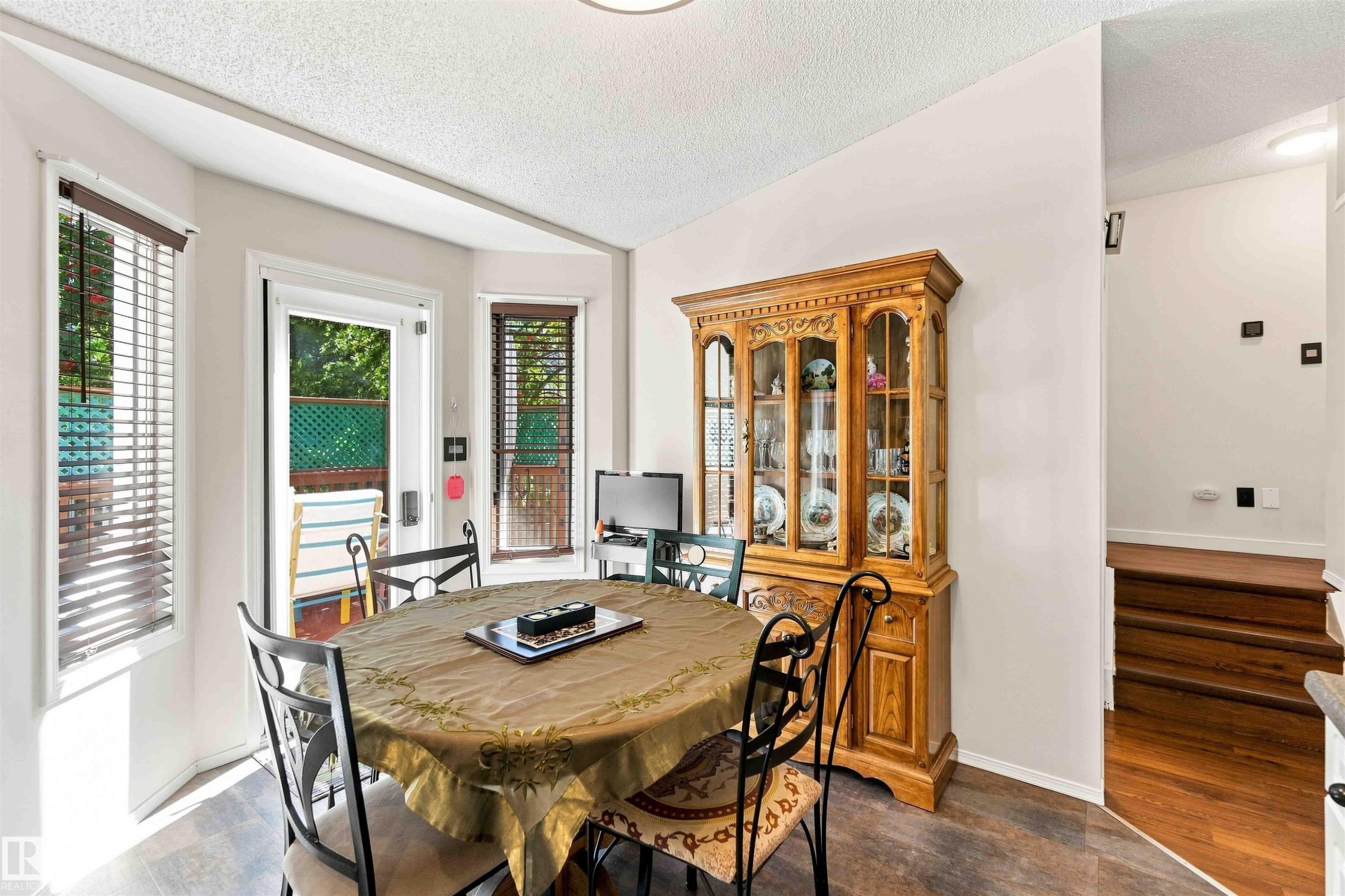Wood-finish flooring throughout, white walls, and a recessed ceiling light - #6 15 Poirier Av, St. Albert, AB