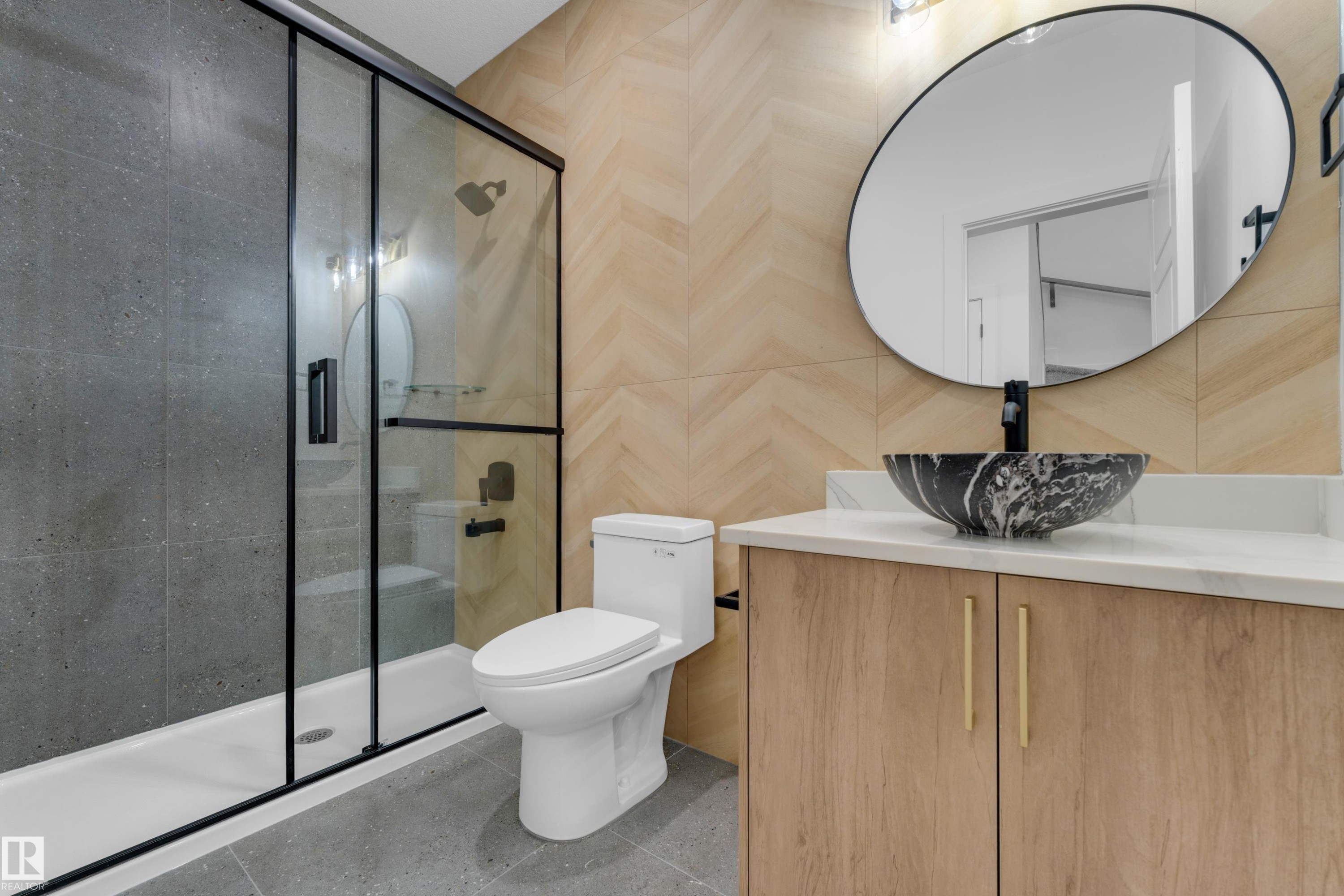 Glass-enclosed shower with black framing, vanity with white countertop, black vessel sink, and wood-finish cabinetry - 236 Linden Loop, Leduc, AB
