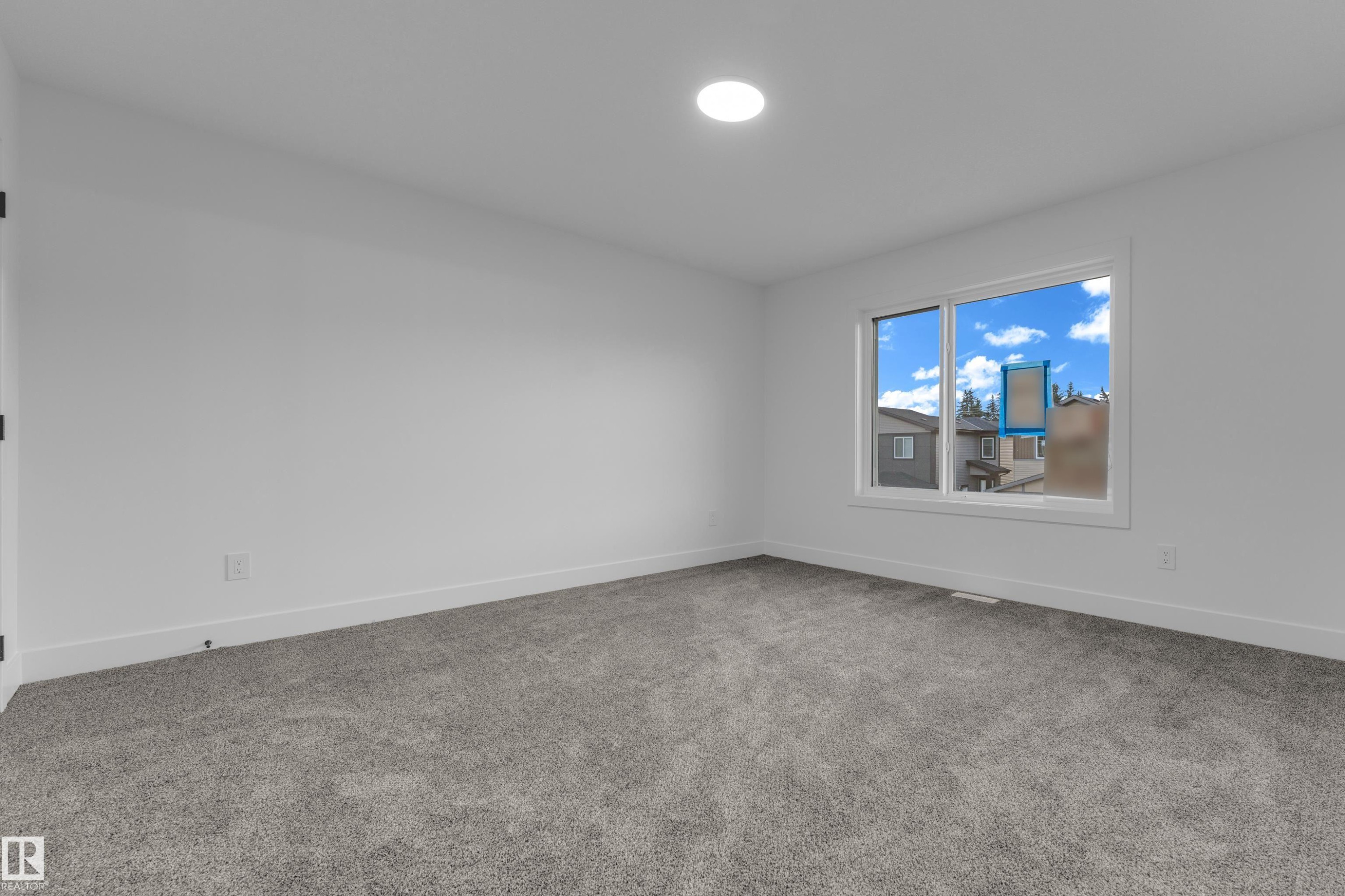 Recessed ceiling lighting, white painted walls, white trim, grey carpeting, and a double-pane window - 236 Linden Loop, Leduc, AB