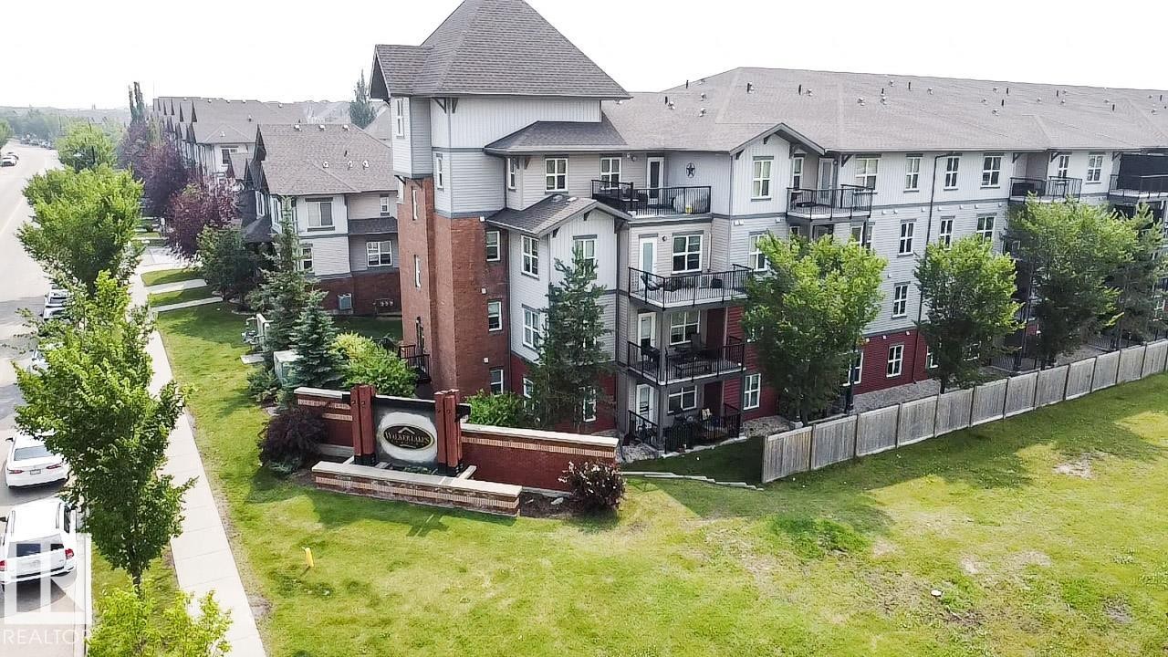 Sprawling residential community featuring multiple architectural styles, including traditional gabled rooflines and brick construction - #62 675 Watt Bv Sw, Edmonton, AB