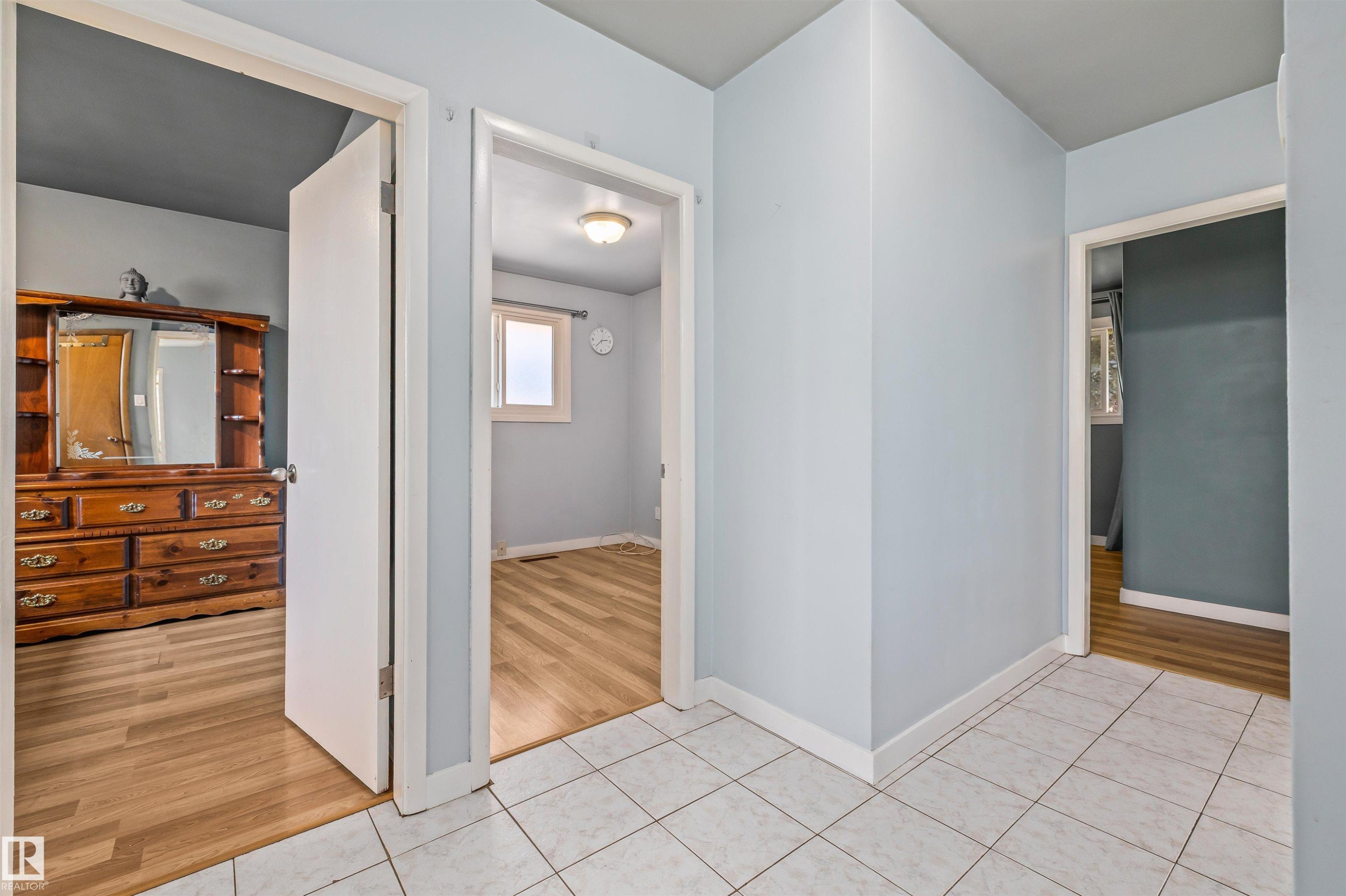 White square tile flooring in the hallway - 13320 123 Street Nw, Edmonton, AB - Indoor Photo Showing Other Room