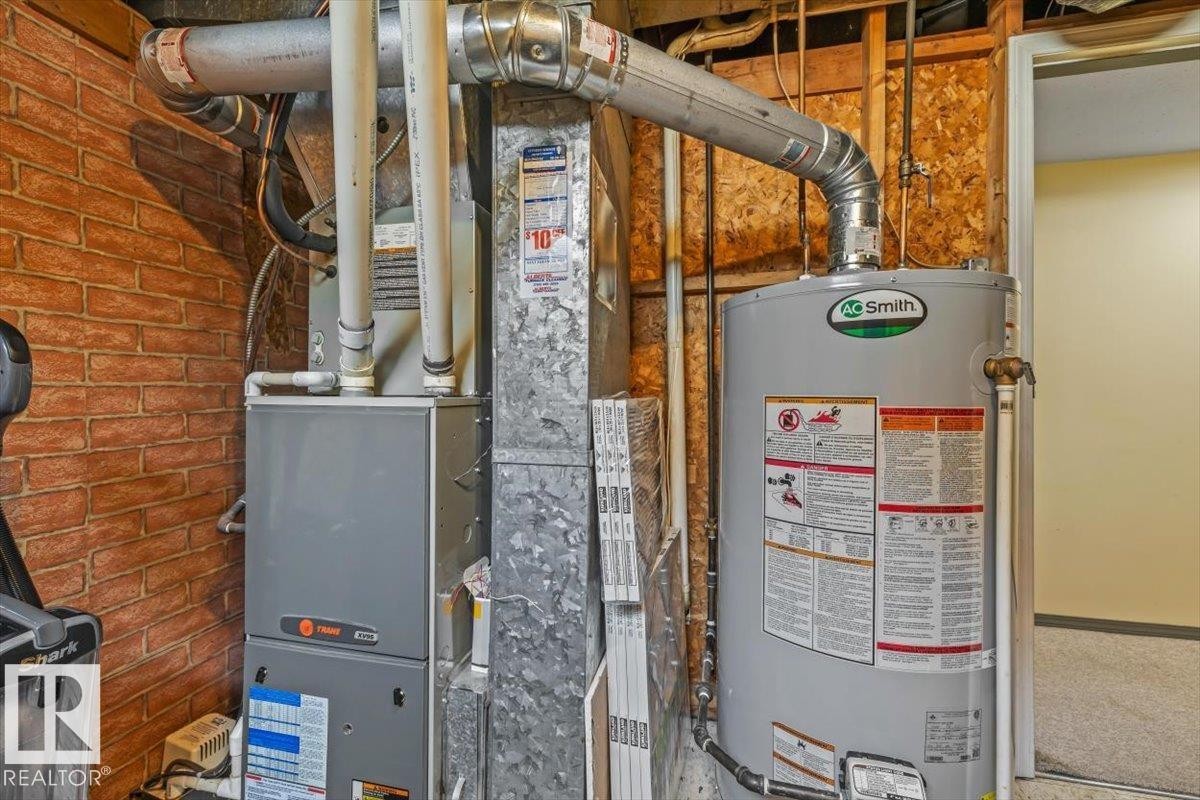 Forced air heating system and water heater installation - 13320 123 Street Nw, Edmonton, AB - Indoor Photo Showing Basement