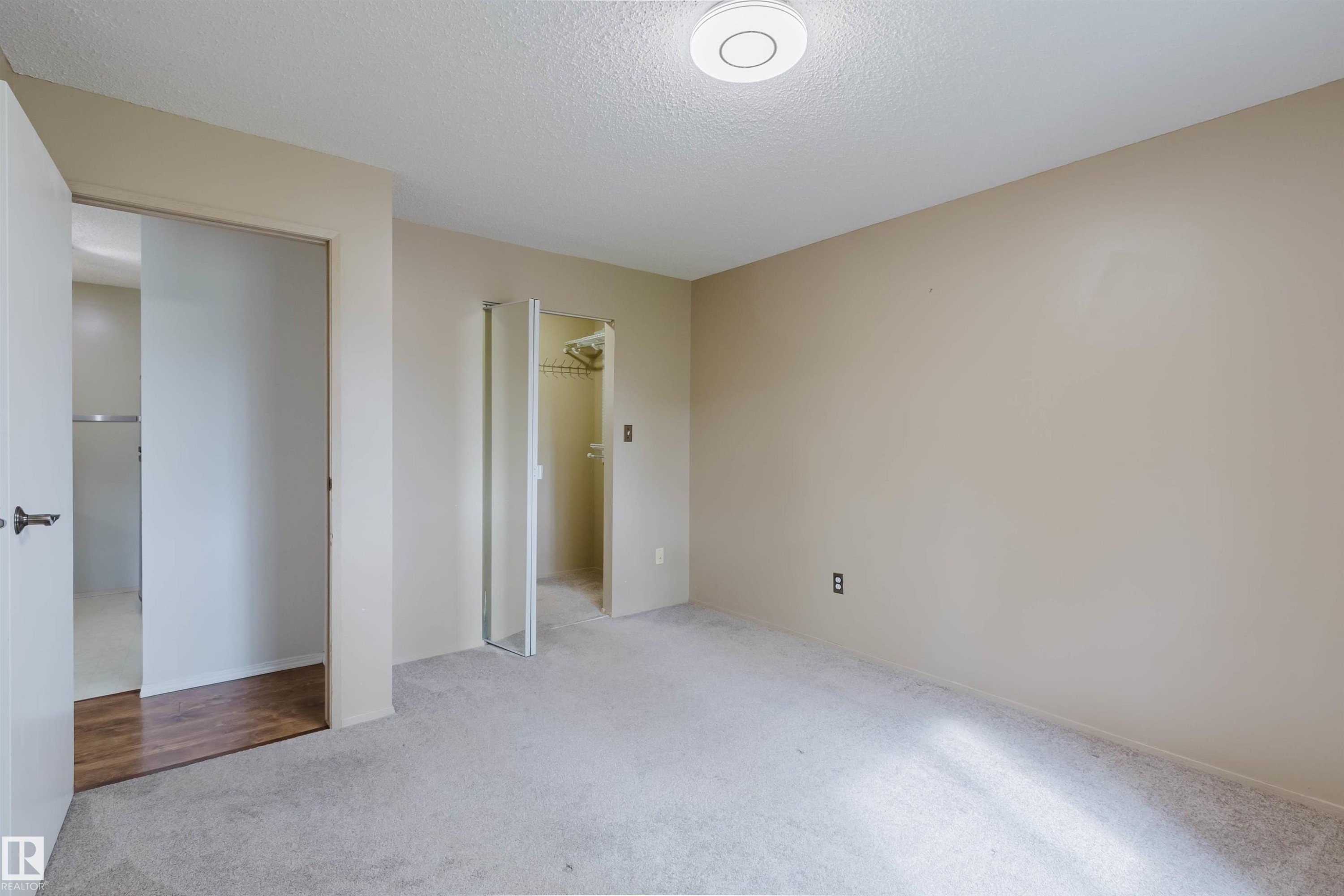 Wall-to-wall carpeting and neutral wall paint - #316 17109 67 Av Nw, Edmonton, AB