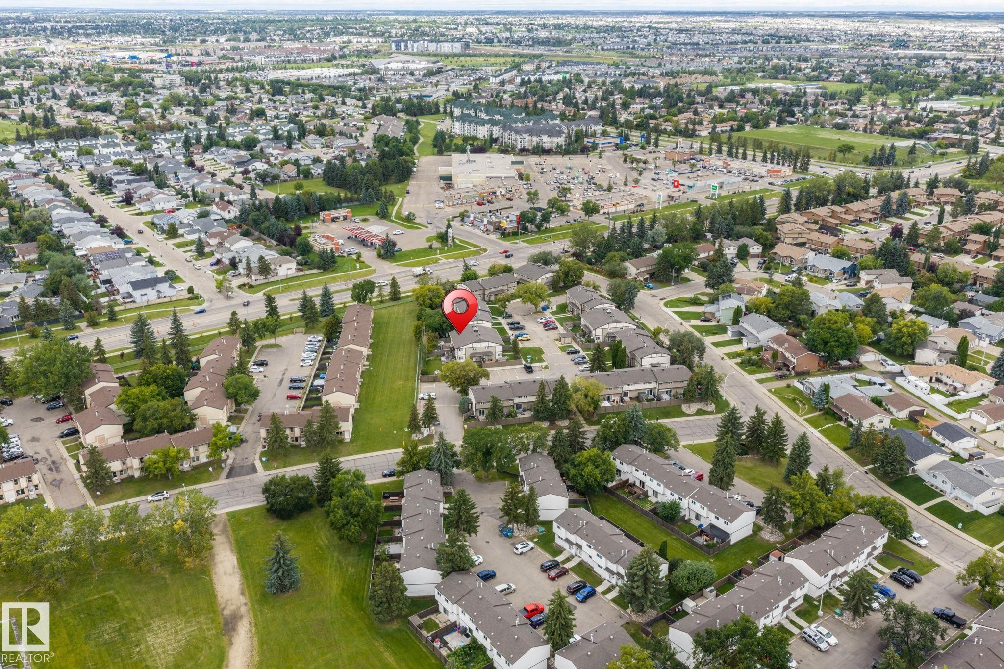 Residential community with tree-lined streets, surrounded by green spaces and commercial areas - 716 Clareview Rd Nw, Edmonton, AB