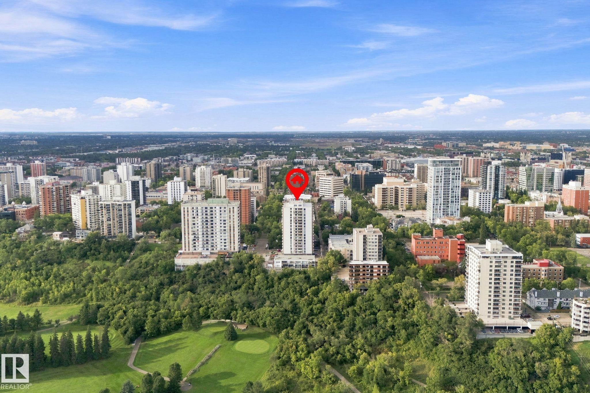 Aerial perspective showcasing a dense urban landscape with extensive tree coverage and a golf course - #1507 9835 113 St Nw, Edmonton, AB